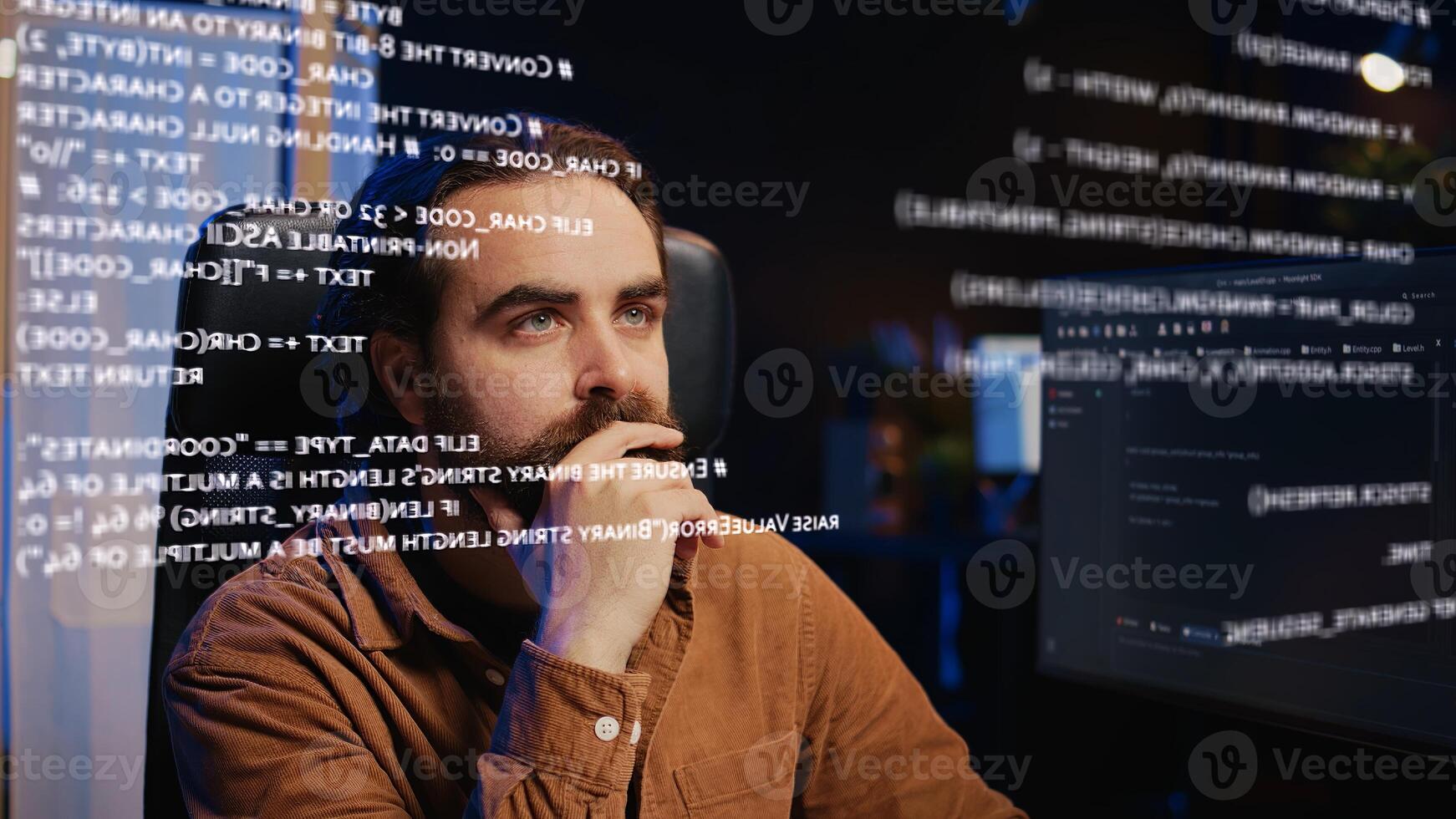 Tech freelancer looking at AR hologram on computer display while doing programming from home. Remote employee using augmented reality technology to visualize lines of code photo