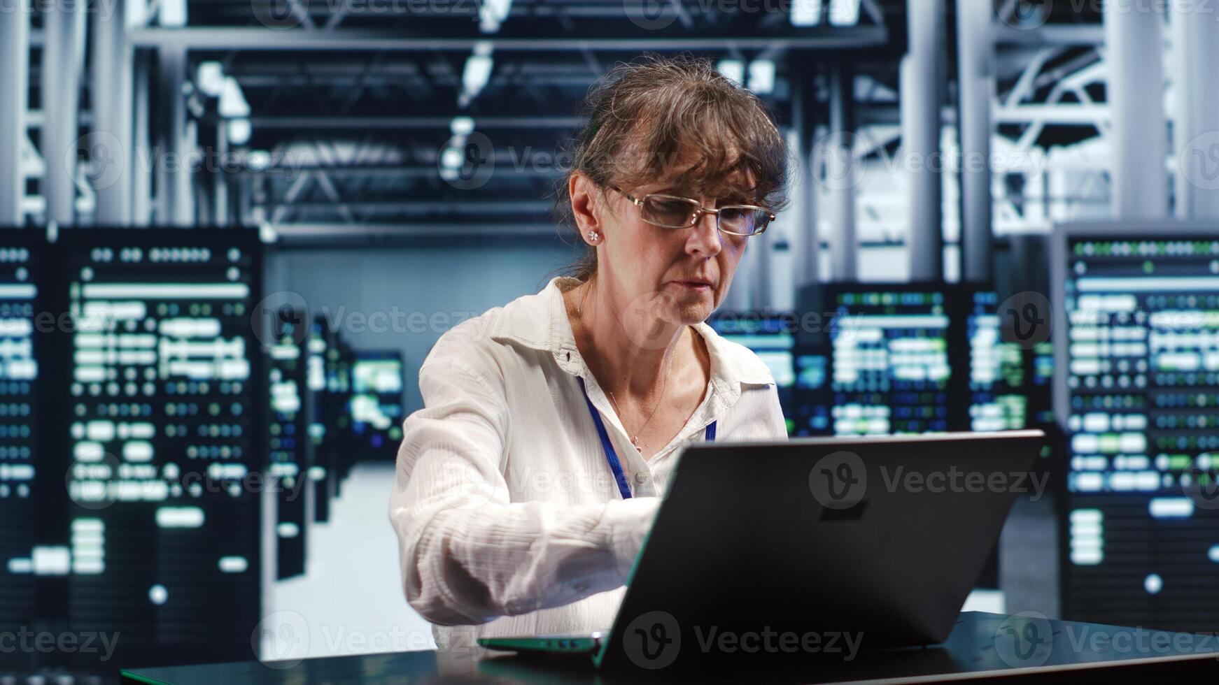 Trained mechanic working in high tech facility housing GPU dedicated servers that can process AI tasks with high efficiency, refurbishing rigs used for machine learning showing issues photo