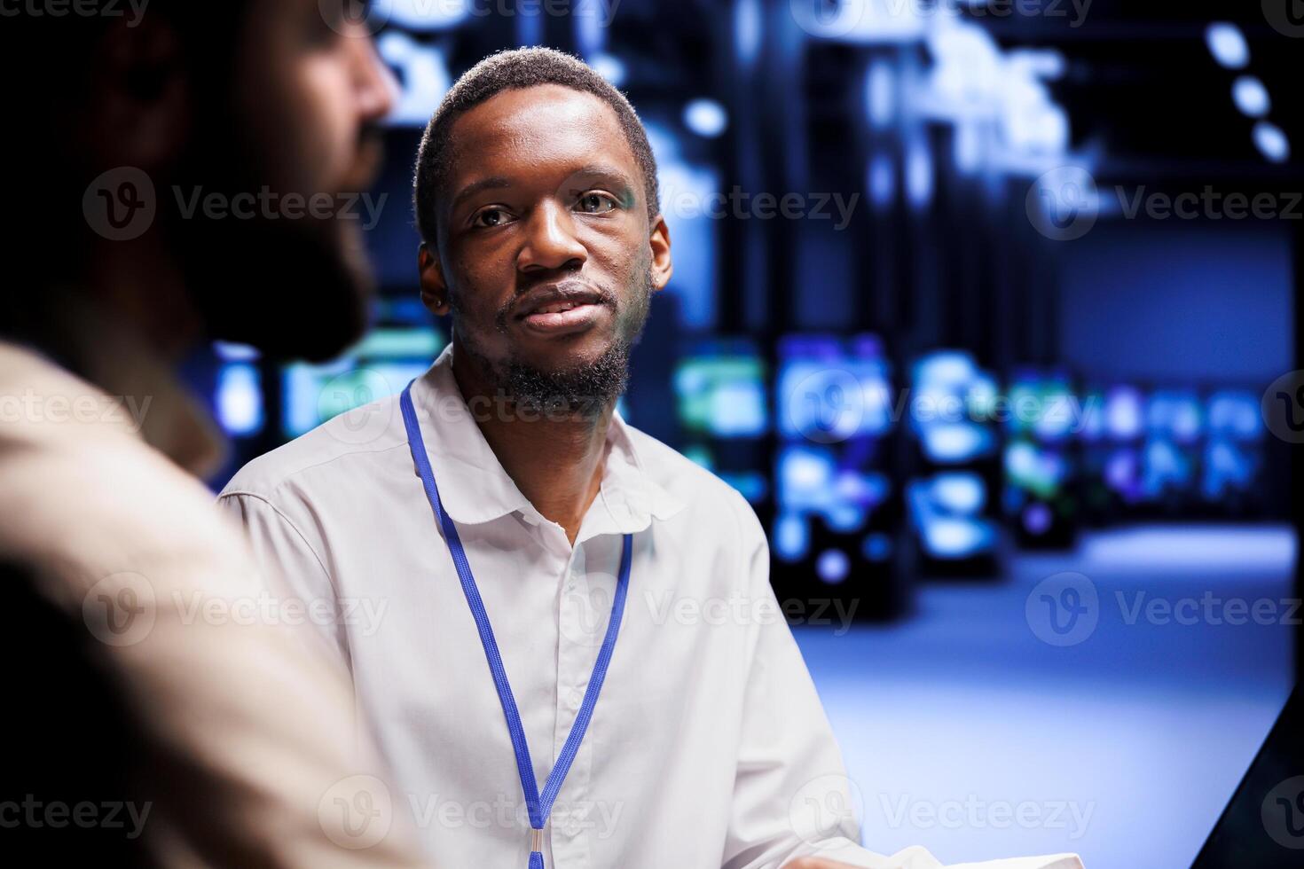Teamworking computer scientists dealing with server cluster system failures. Servicemen brainstorming ideas on how to best minimize cloud computing business downtime and prevent crashes photo