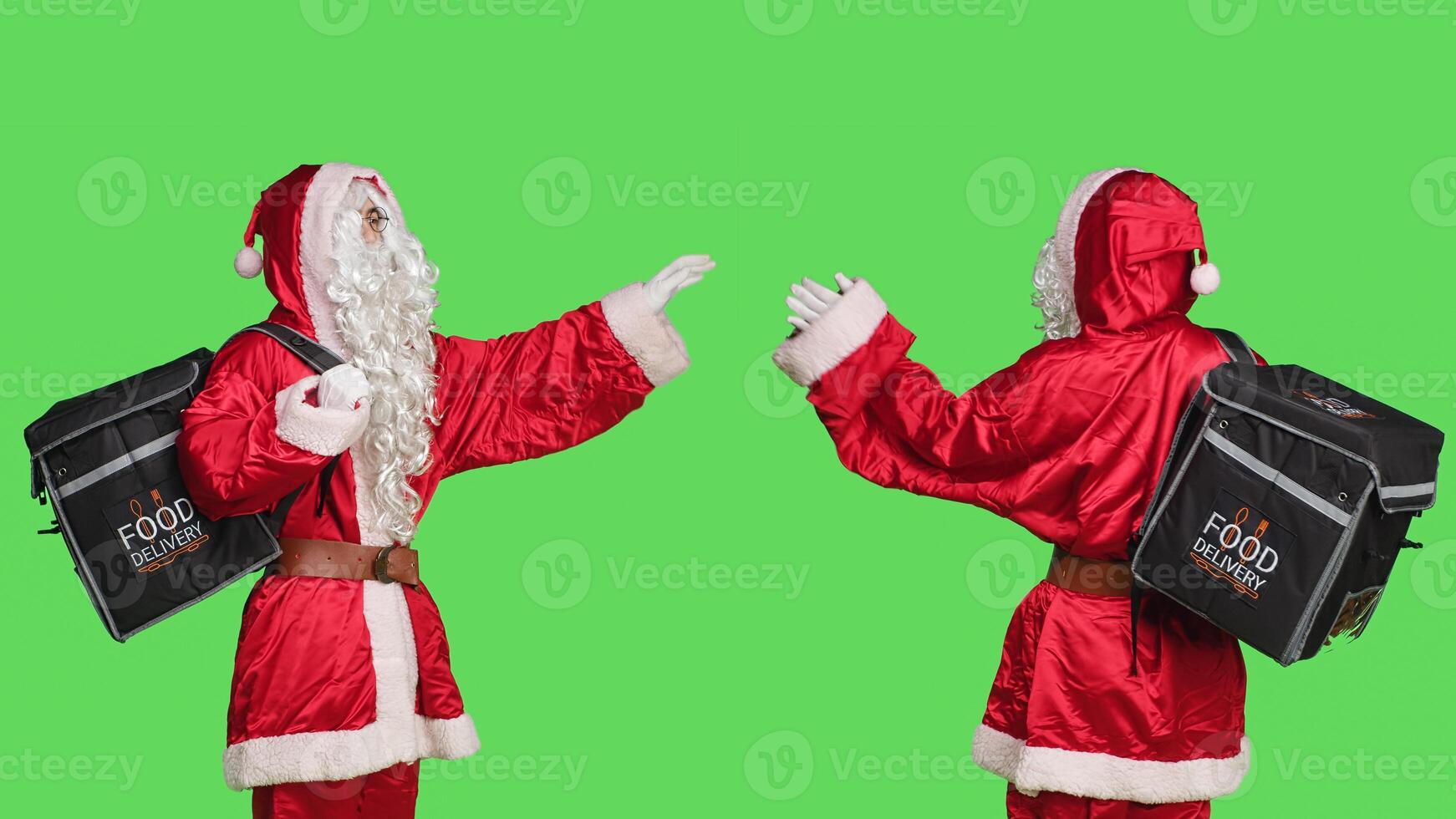 Man in santa suit with delivery backpack over greenscreen background, delivering food while he wears festive christmas eve traditional costume. Joyful person brings holiday spirit. photo