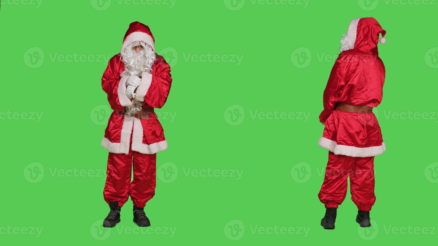 Saint nick being impatient and looking at wristwatch not to be late, wearing traditional winter costume during festive holiday. Santa claus with white beard checking time, greenscreen. photo