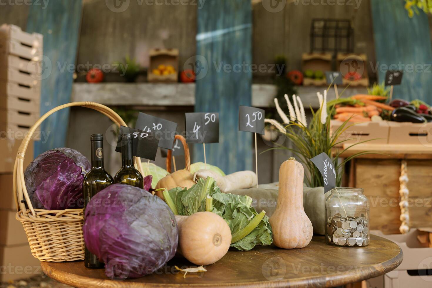 Closeup of local bio products on display alongside fresh organic agricultural produce at farmers market. A table with variety of colorful eco seasonal fruits and vegetables at harvest fair festival. photo