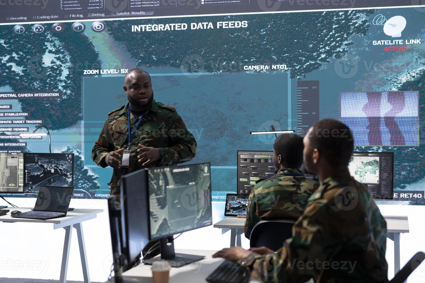 Military personnel operate advanced systems in a command center, focusing on surveillance and data analysis to protect national security. Soldiers trained to manage information warfare. photo
