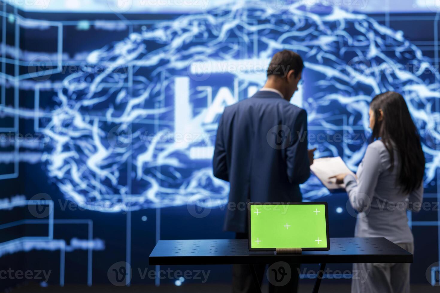 AI developers colleagues using green screen laptop for business data analysis. IT specialists in high tech location work on chroma key notebook to automatize tasks using artificial intelligence photo