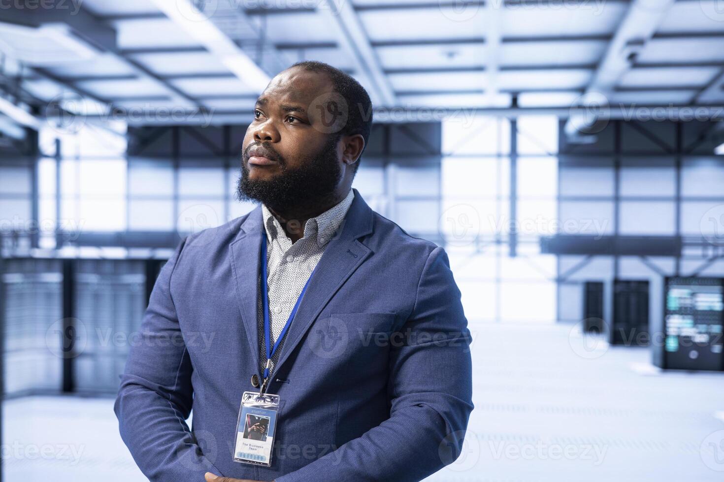 Engineer walking in data center, configuring and managing network infrastructure, such as routers, switches and firewalls. IT expert in server hub looking for technical issues photo