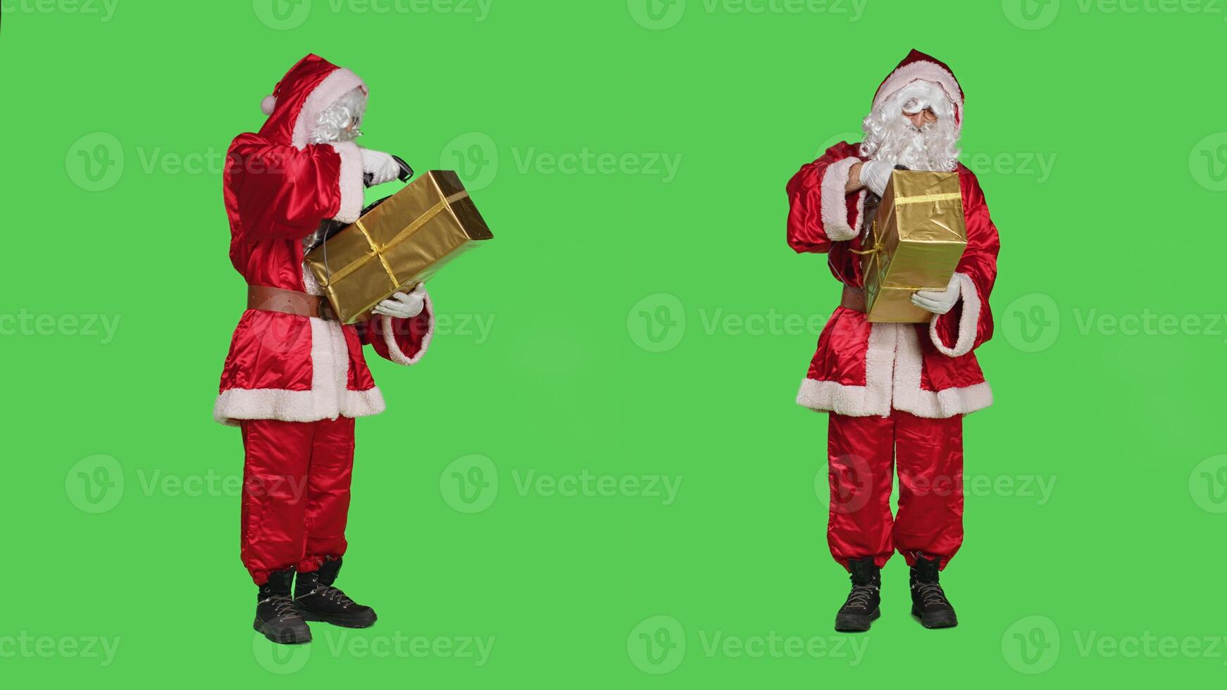 Saint nick in suit scanning present box, preparing to deliver gifts to children around the world. Young man acting like santa with red costume, holding festive package with ribbon. photo