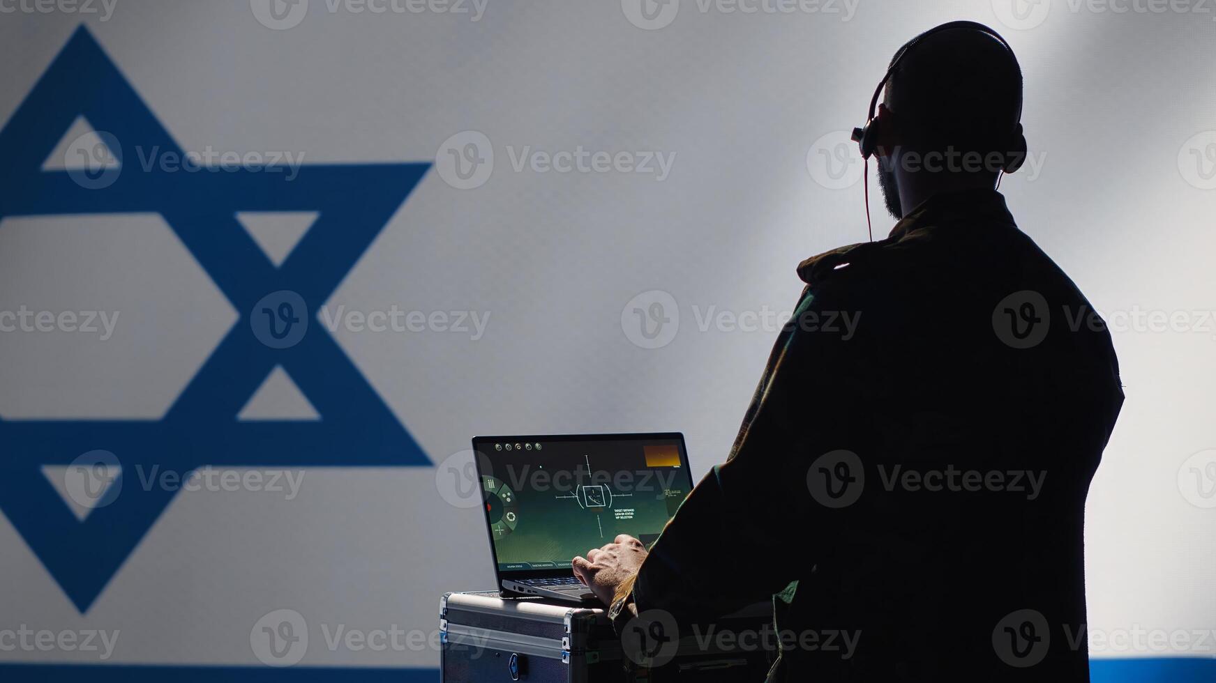 Israeli air defense command operator conscript using radar system on laptop to detect incoming ballistic missiles. IDF army soldier scanning rockets approaching borders, deploying shields, camera A photo