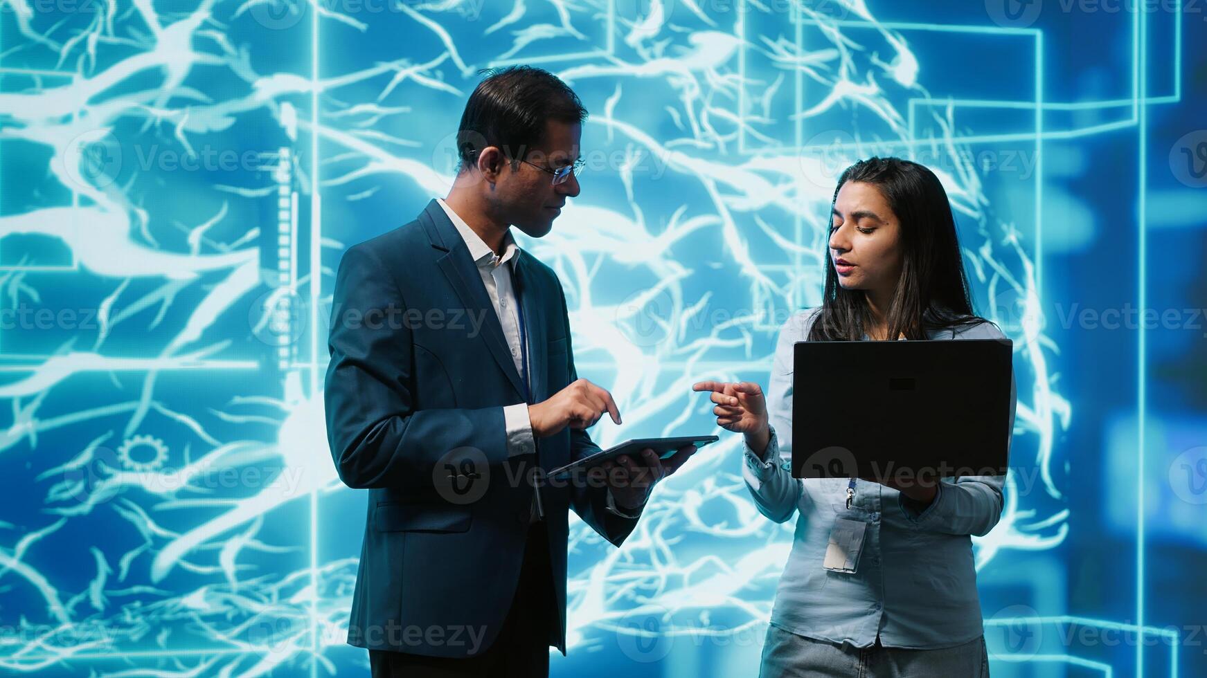 Software developers use neural networks modeled after human brain to solve complex problems. IT specialists in high tech workspace using artificial intelligence to look at data photo