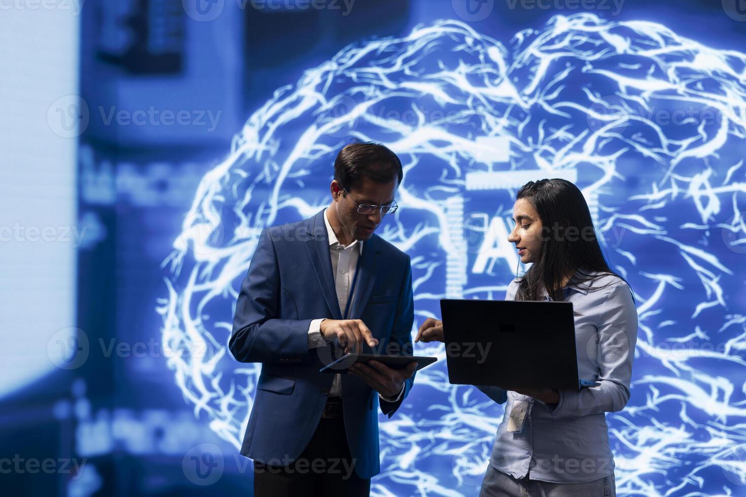 Software engineers use neural networks modeled after human brain to solve complex problems. IT experts in high tech workspace using artificial intelligence to look at data photo
