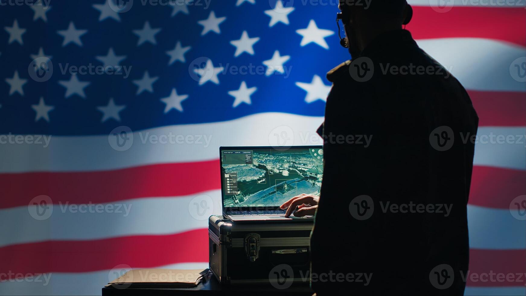 US Air Force agent using radar system on laptop to detect incoming ballistic missiles. American NATO army soldier scanning rockets approaching borders, deploying shields, United States flag, camera A photo