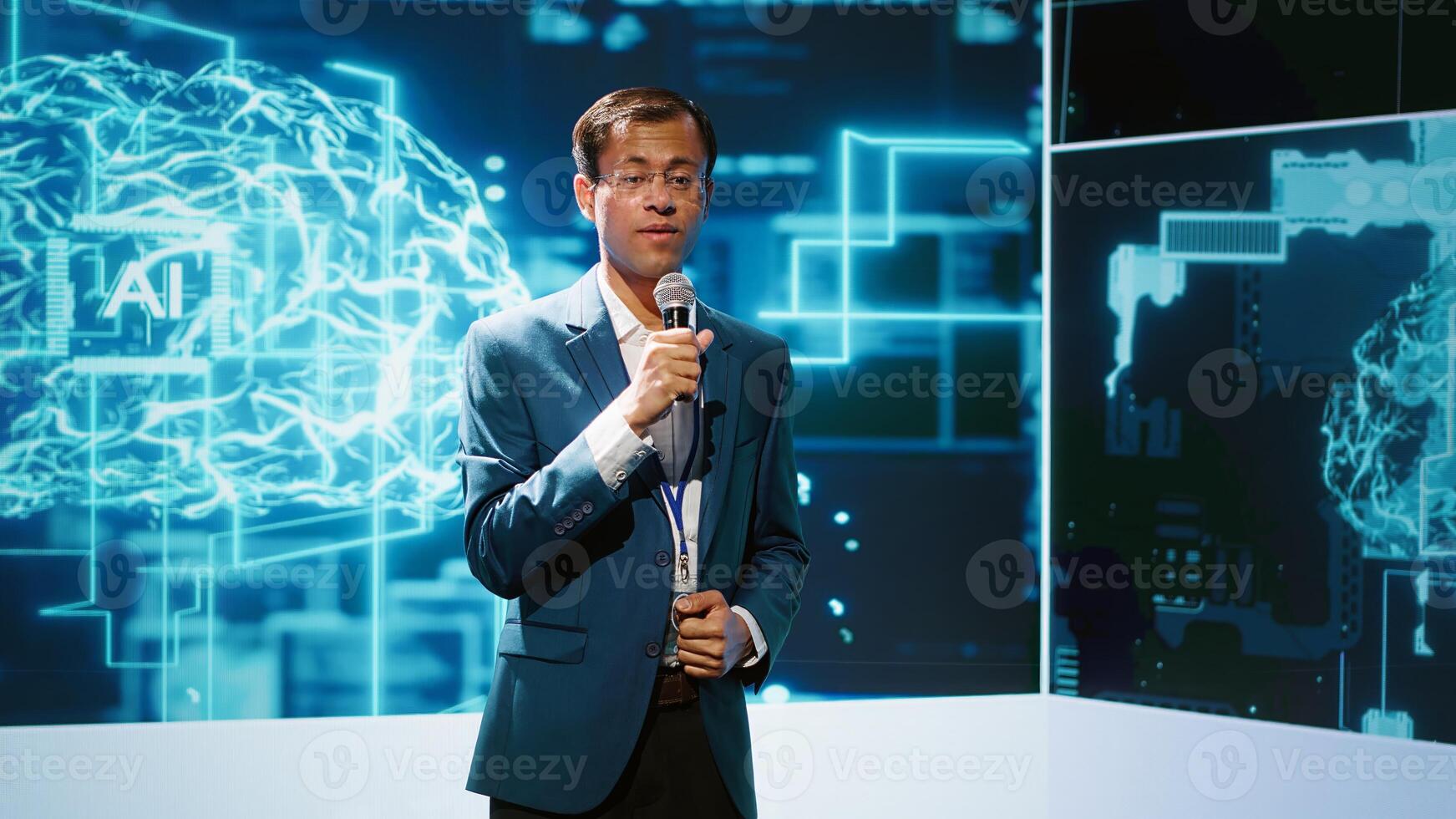 Presenter talking with spectators at AI convention bringing together IT specialists, sharing insights from latest developments in artificial intelligence and cognitive computing, camera A photo