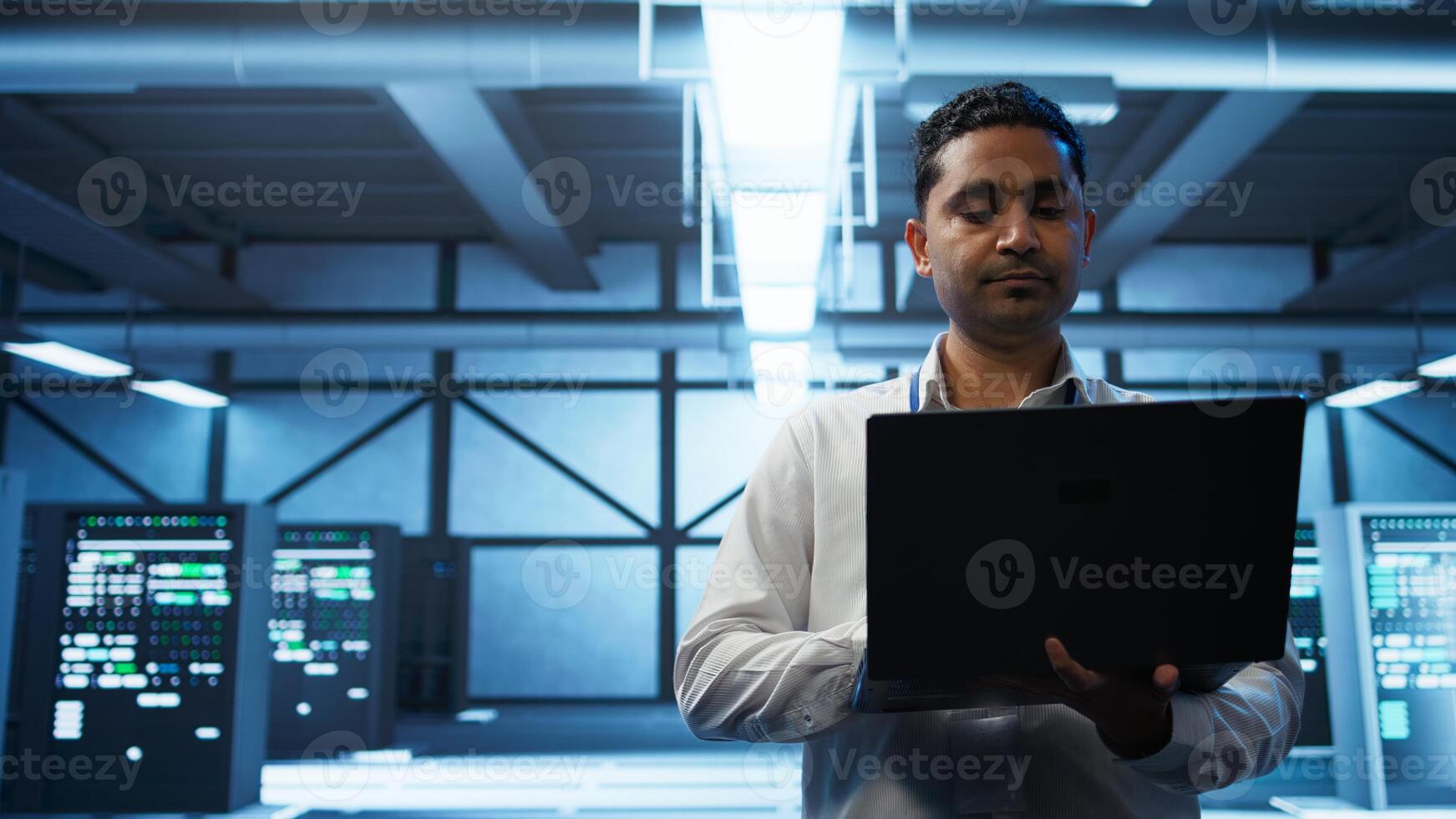 System administrator in data center managing servers, operating systems and software applications. Expert in server hub ensuring networks are secure, up to date, and functioning properly, camera B photo
