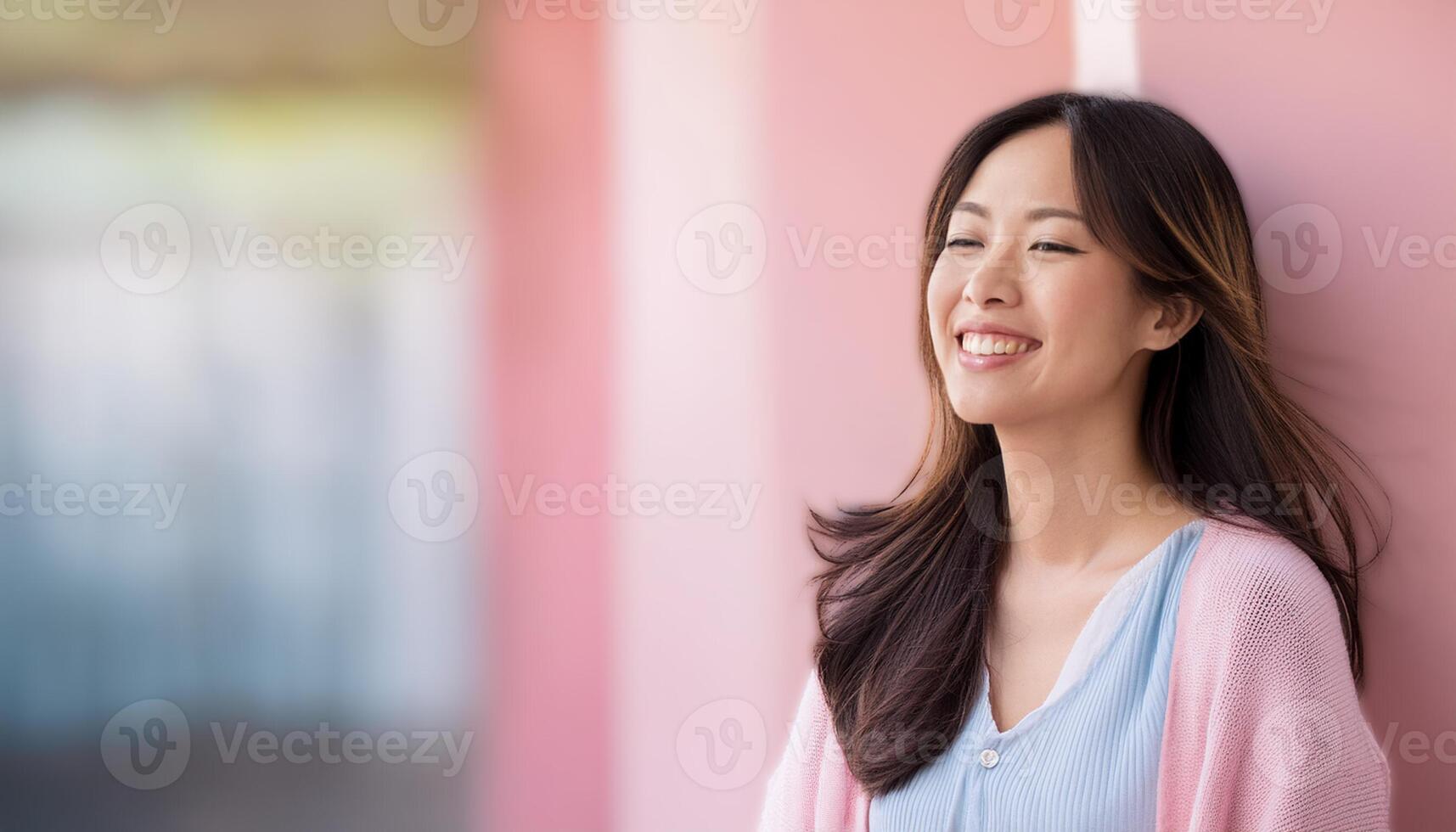 A beautiful Asian girl smiling happily, radiating joy and positivity. The image captures her genuine and cheerful expression, making it ideal for content related to happiness, positive emotions photo