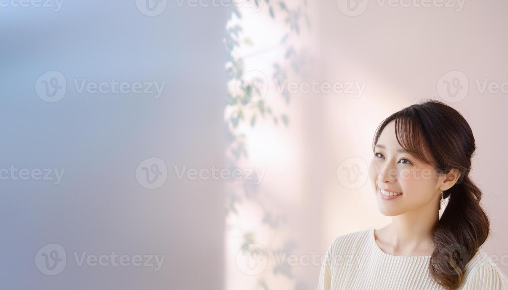 A beautiful Asian girl smiling happily, radiating joy and positivity. The image captures her genuine and cheerful expression, making it ideal for content related to happiness, positive emotions photo