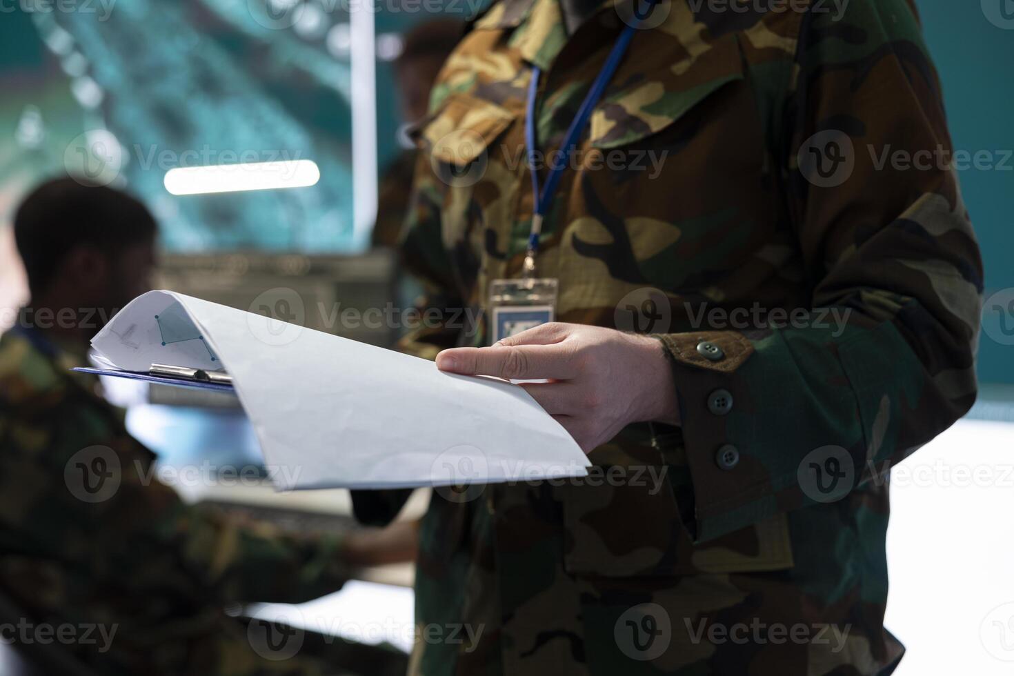 Trooper reading federal case file for a new defense operation, studying tactics and objectives before briefing the soldiers. Army specialist creating attack plans to ensure mission success. photo