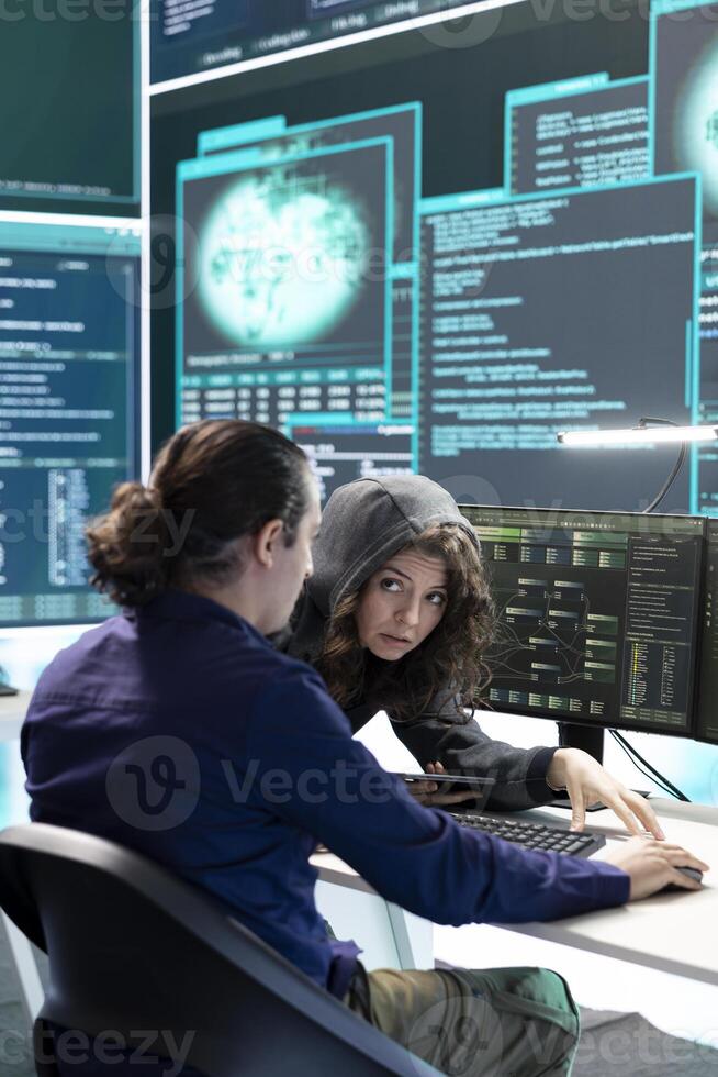 Governmental hackers doing teamwork in protecting sensitive information from cyber threats of digital mercenaries. Experts focusing on online security and cyber defense tactics. photo