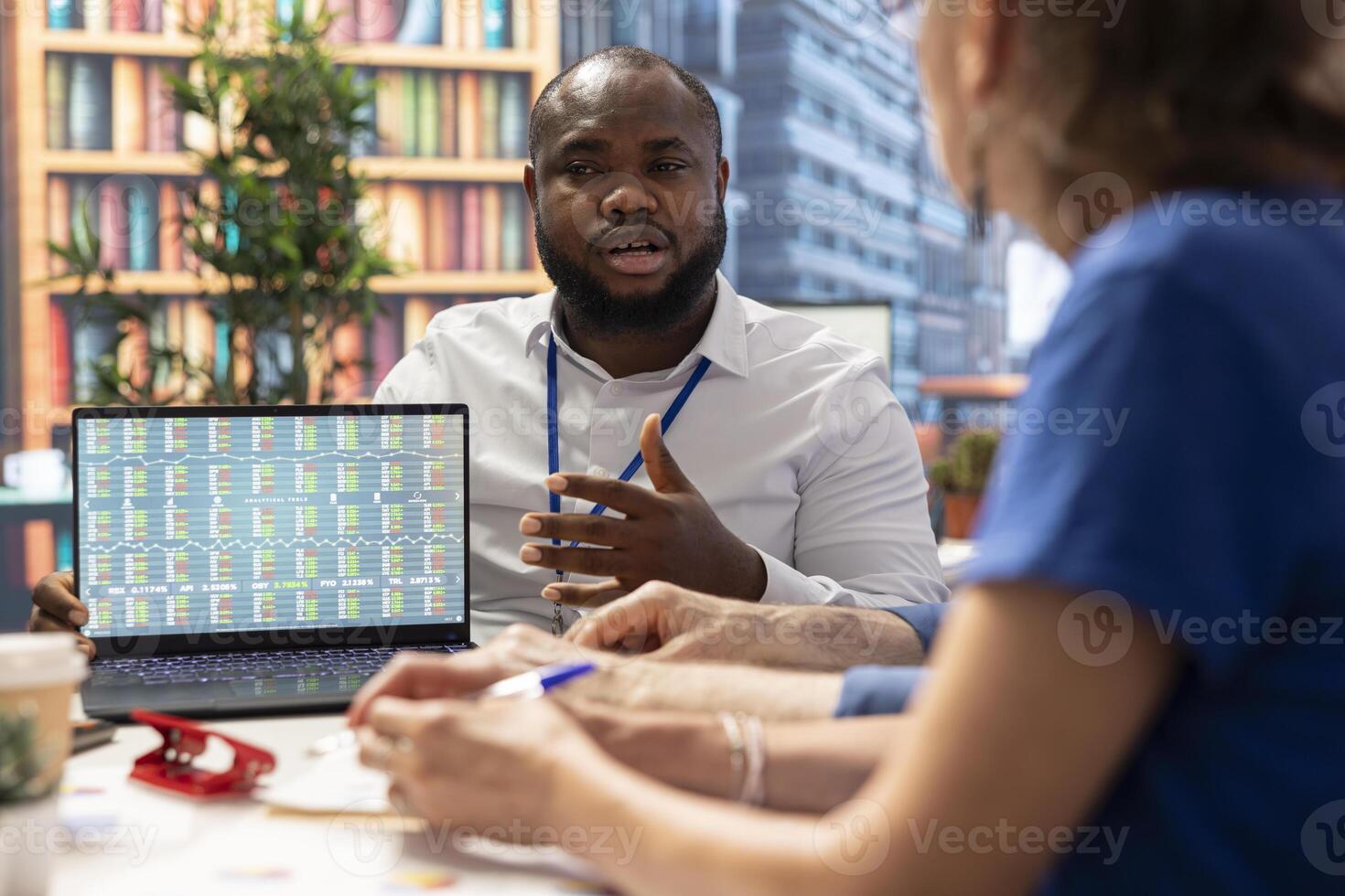 Financial adviser presenting professional retirement plan option, explaining all terms and policies to secure a pension for the future. Helping clients manage life savings. photo