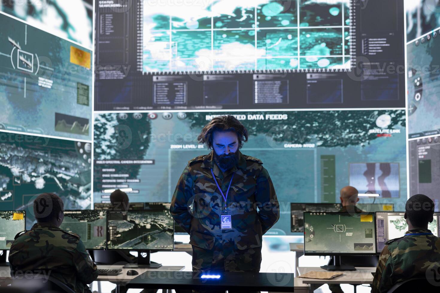 Army officer analyzing surveillance data on a hologram projection, reviewing registered information from satellite surveillance system. Looking at new defense operation details in power base. photo