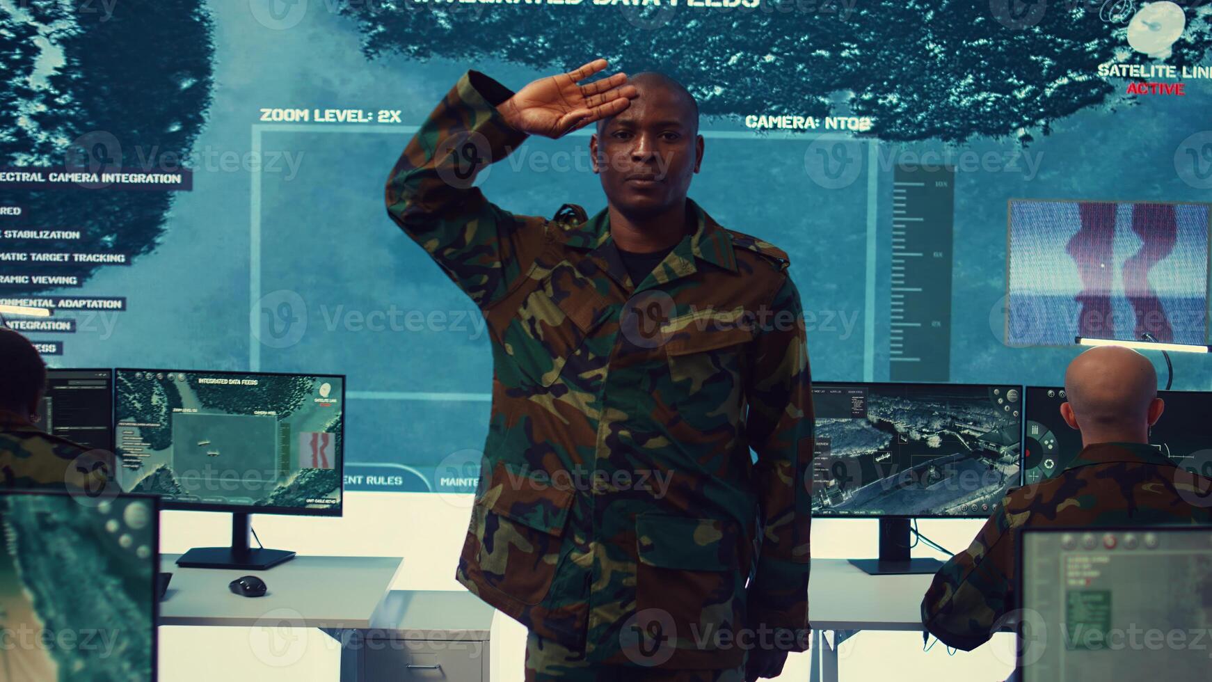 Standing at attention, the soldier executes the military salute gesture to present his respect and devotion as captain of the crew. Patriot army general saluting with right hand to his temple. Camera B. photo