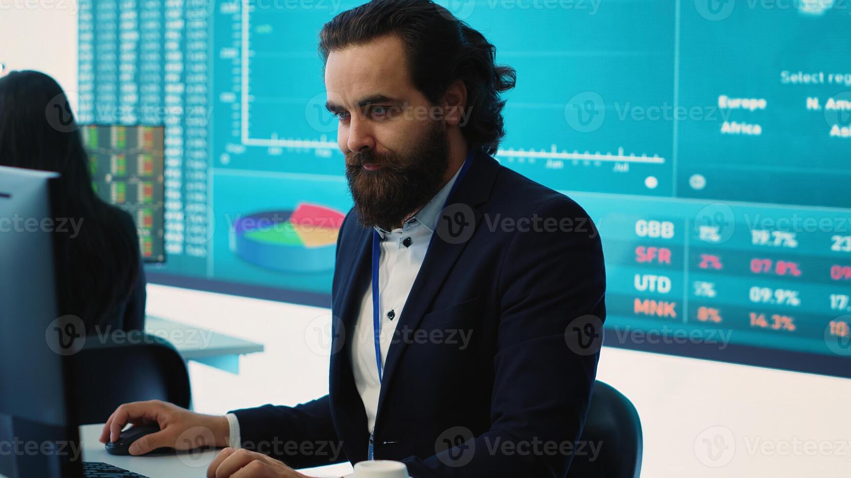 Corporate employee looking into project details and timetables in open coworking space, establishing budget and operations to accomplish goals in a competitive environment. Camera A. photo