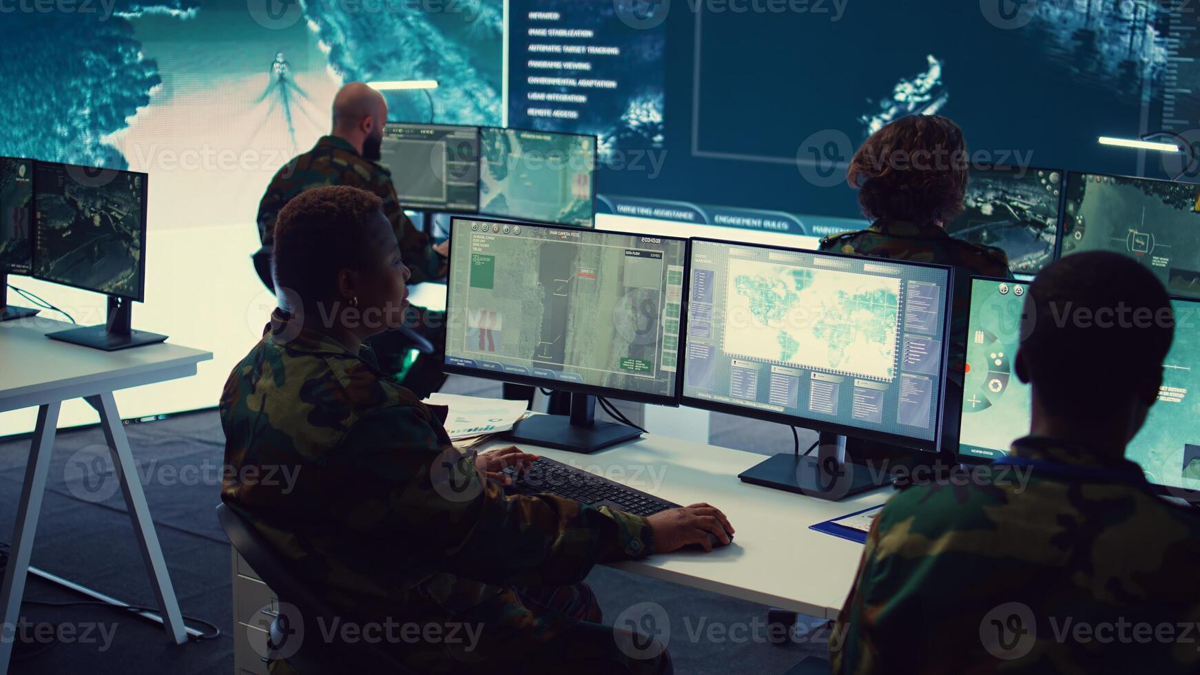Army officer establishing new operating bases through a world map satellite vision, ensure the connectivity to the power base command center. Commander operates CCTV radar footage. Camera B. photo