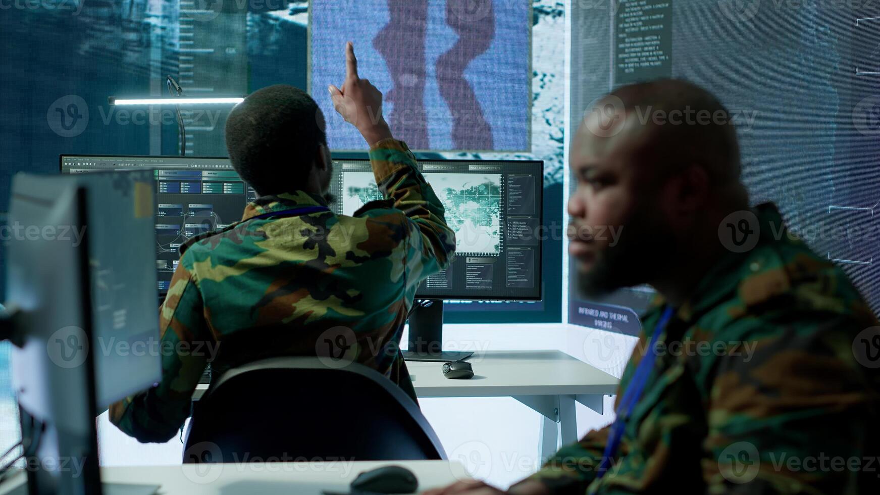 Group of soldiers in a secure office environment collaborates on intelligence analysis, and strategic planning. Crucial efforts for maintaining national security and operational efficiency. Camera A. photo