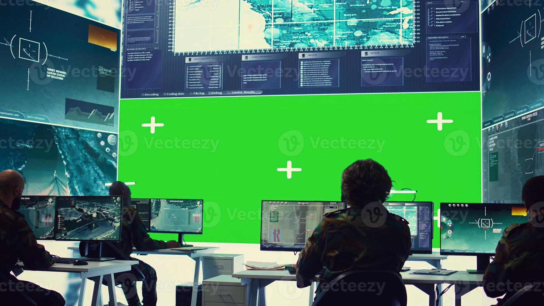 Team of IT military specialists working with a greenscreen on a big display, searching for real time data via reconnaissance CCTV system. Soldiers in power base transmitting information. Camera B. photo