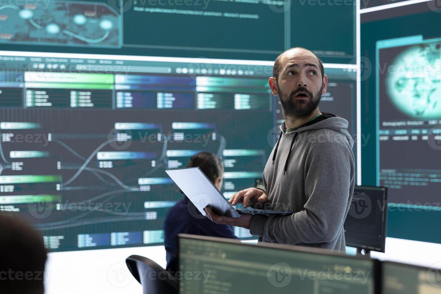 Hackers team engaging in governmental espionage and using phishing techniques for illegal access to data, working on national security breach. Spyware agency gains access on a big screen. photo