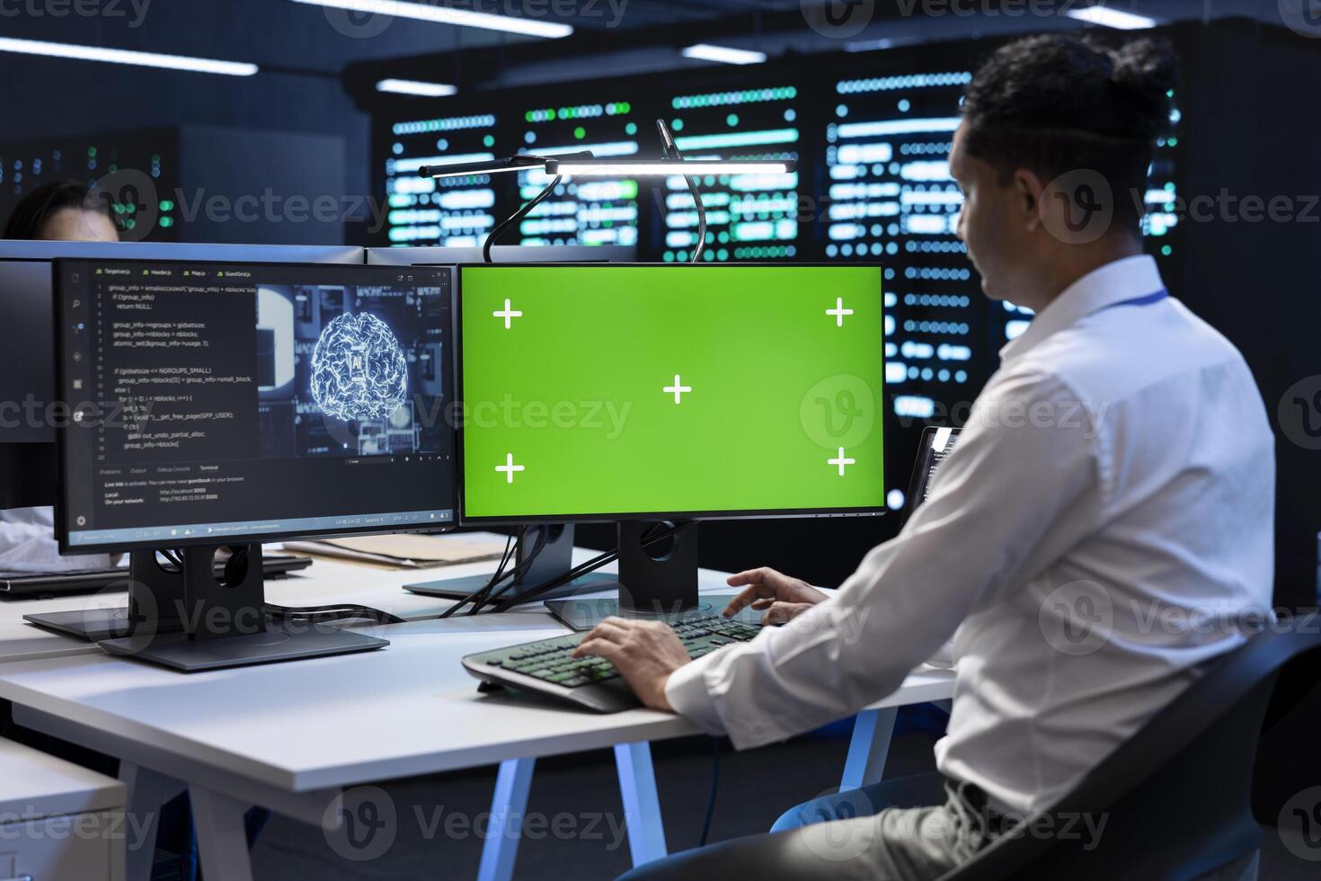 Programmer working on green screen computer in data center with artificial intelligence tech to process datasets. Employee solving tasks on mockup PC in server hub storing data used for deep learning photo
