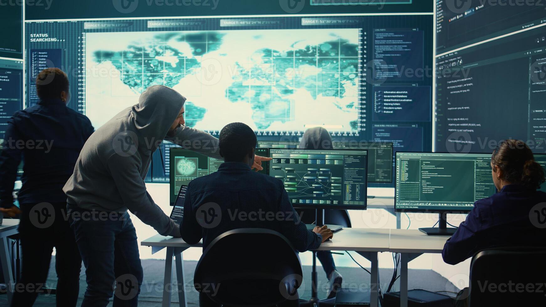 Cyber security team conducting cyber surveillance and threat detection in a governmental agency. Hackers working on cybercrime and malware prevention, data breach protection. Camera B. photo