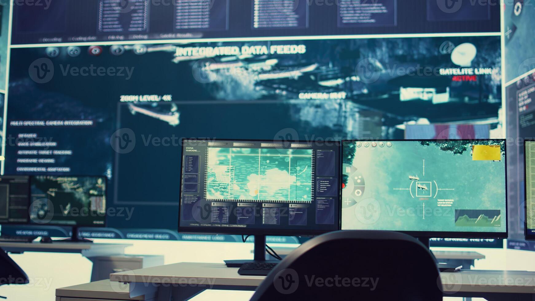 Government anti terrorism operation room equipped with a big display and surveillance on satellite radar cctv used for reconnaissance. Empty military command center with high tech. photo
