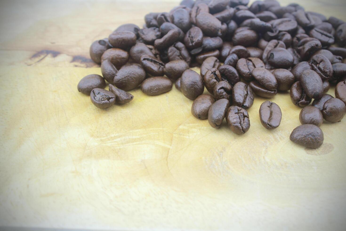 Coffee beans on wood background photo