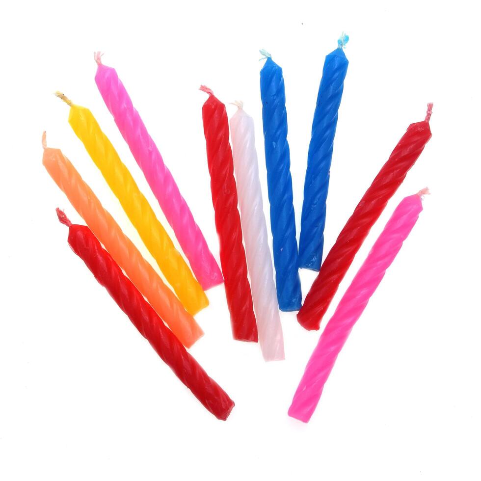 Set of colored birthday candles isolated on white photo