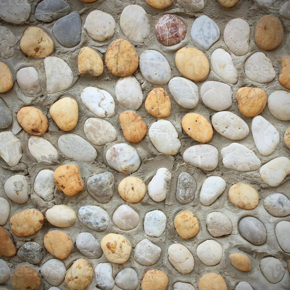 background made of a closeup of a wall with pebbles photo