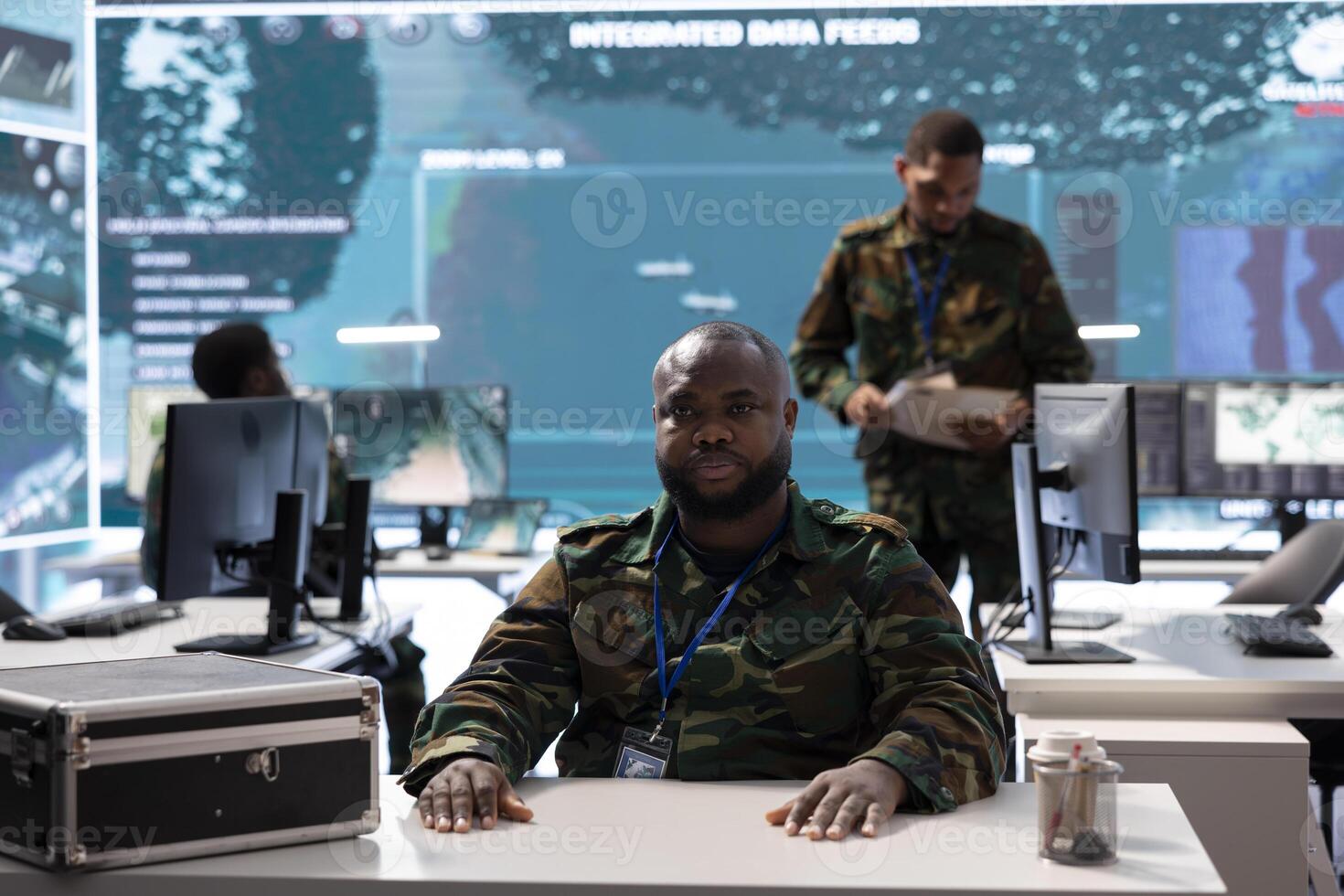 Military command center with soldier conducting a high security videoconference, coordinating real time intelligence for national defense and surveillance operations. Protect the nation. photo