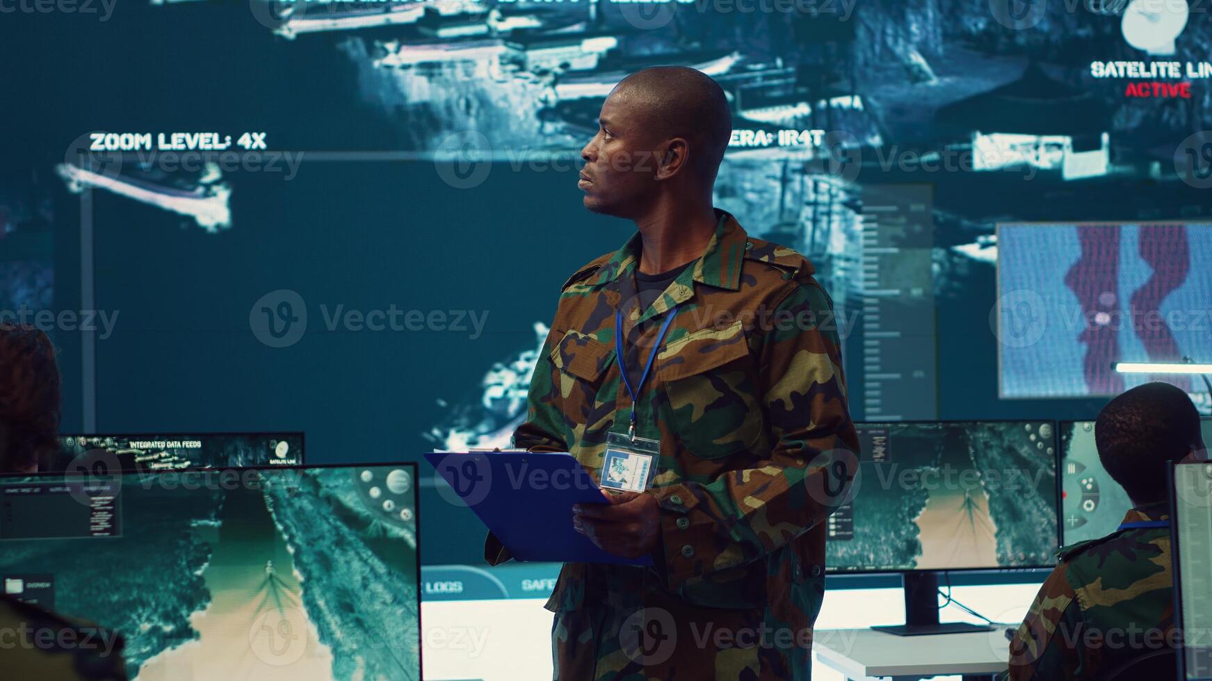 Navy captain oversees collecting important data for a national defense mission, targeting enemy vessels with the satellite radar system. Reconnaissance in a military base of operations. Camera A. photo
