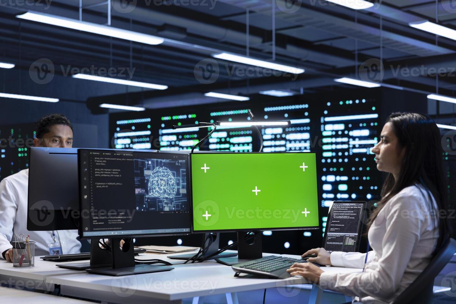 Developer works on isolated screen device in data center with artificial intelligence tech to process datasets. Worker solving tasks on chroma key PC in server hub storing data used for deep learning photo