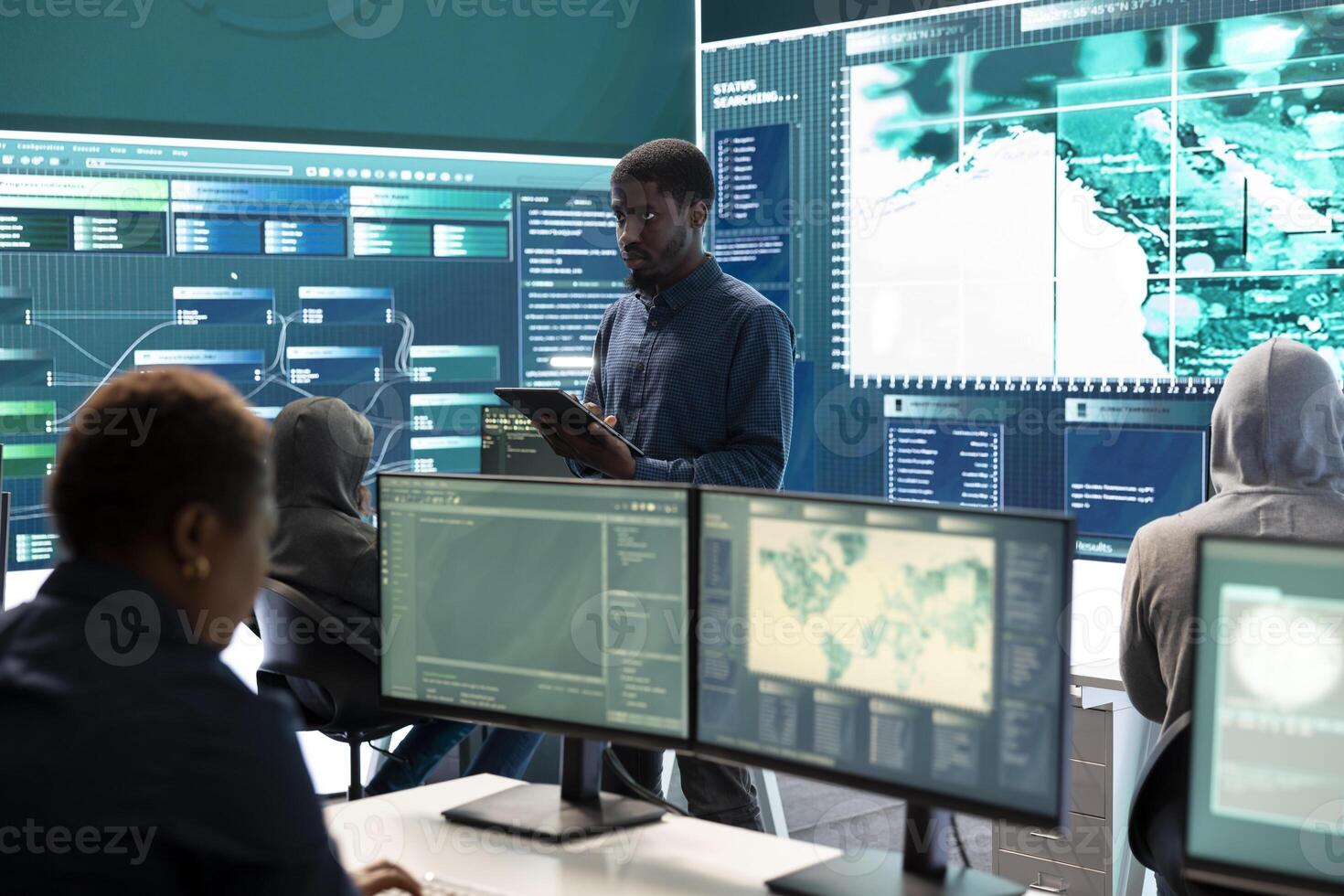 Governmental agency cyber defense team analyzing cyber attacks. IT security professionals working to prevent data breaches and protect against cybercrime, securing digital information. photo