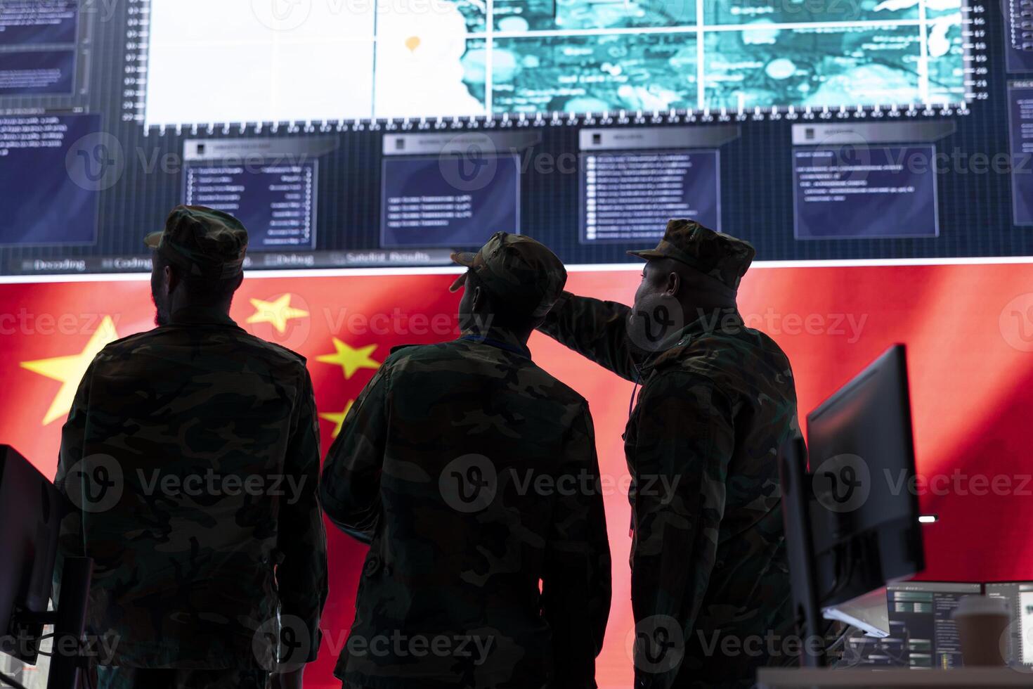 Soldiers team in a Chinese military control center reviews tactical data on a big screen. Army officers examining world map and surveillance footage to ensure tactics, hybrid warfare. photo