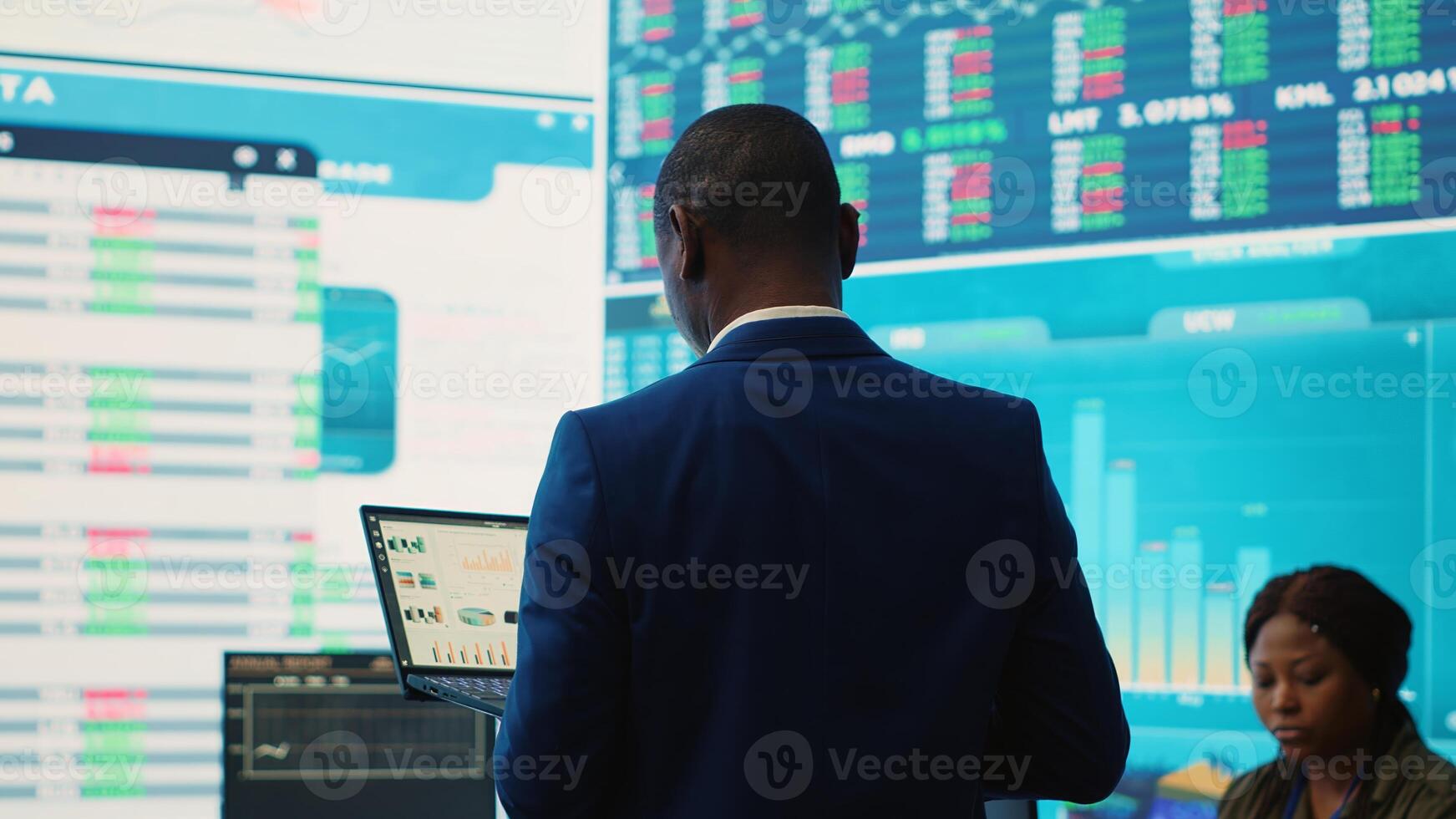 Administrative assistant examining important big data visualizations on a huge display, creating an analysis to review key performance indicators and business efficiency. Camera A. photo