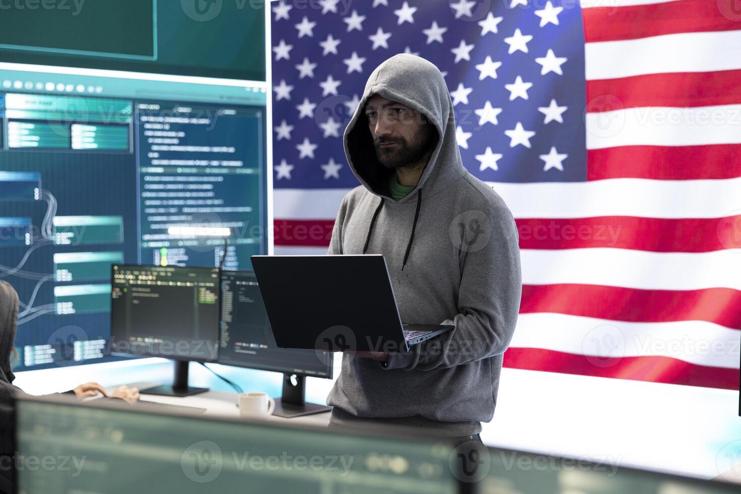 Cybersecurity specialists in a high tech office with the American flag, focusing on cyber intelligence and secure network operations. Works on information security and malware detection. photo