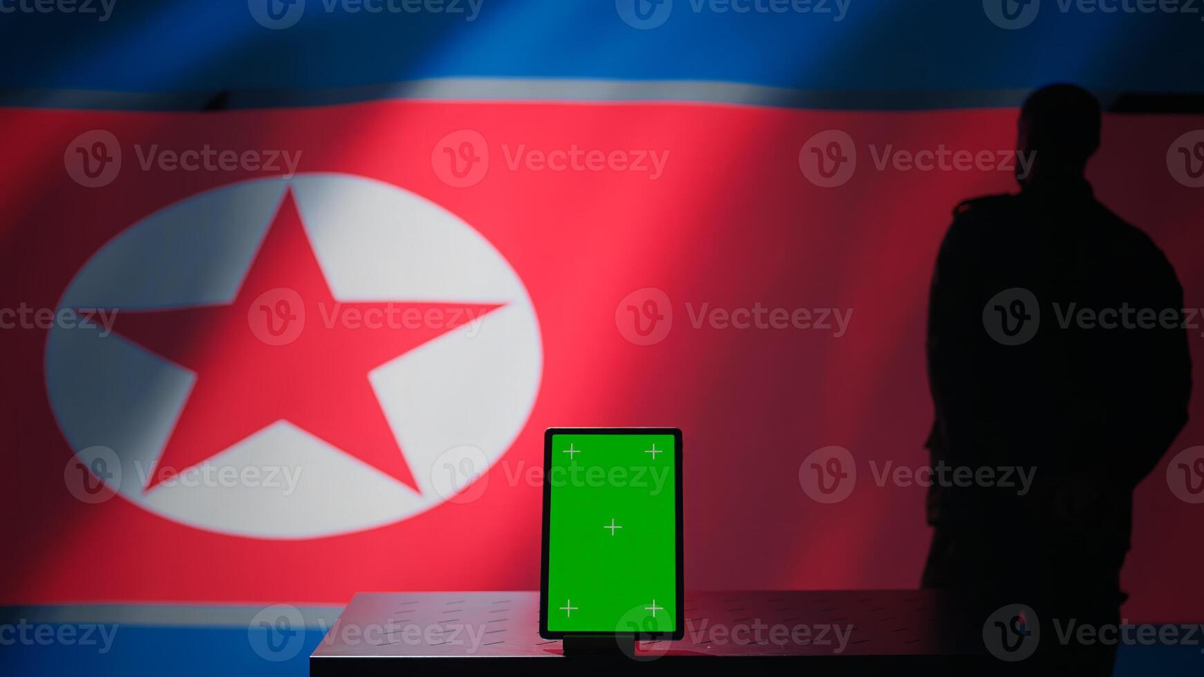 North Korean engineer makes troll accounts with mockup tablet on social media promoting communist ideology. Admin works for Pyongyang regime building algorithms to spread government doctrine, camera B photo