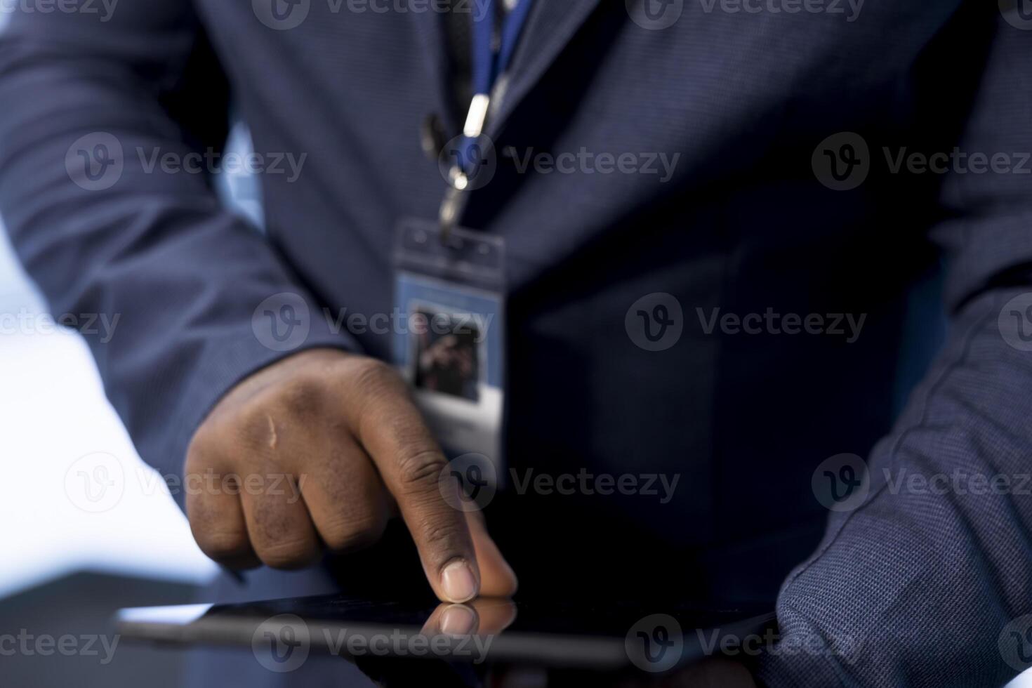 System administrator in server room installing newly ordered storage units using tablet. Close up of IT expert working in data center workspace housing storage rackmounts hardware photo