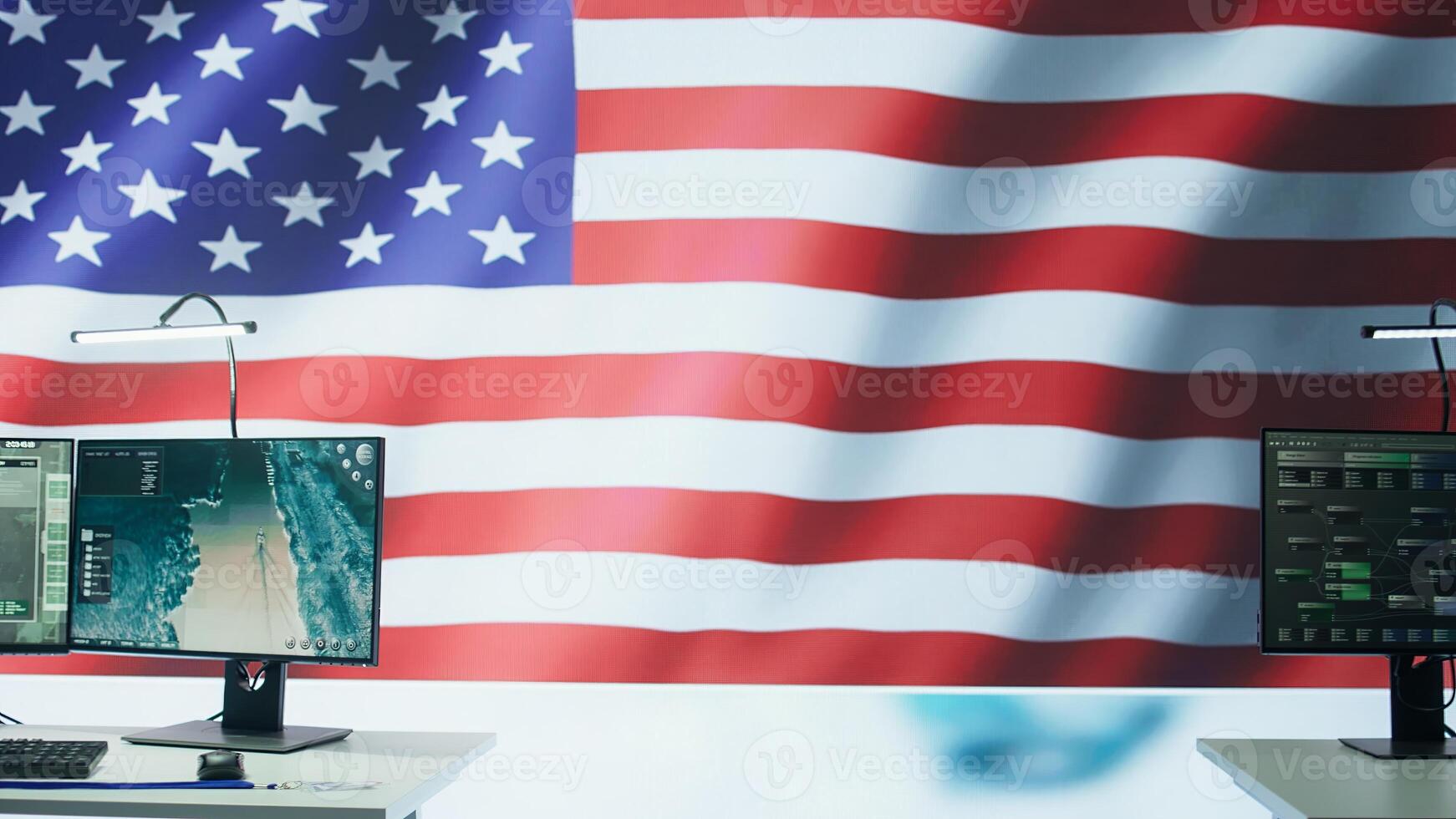 Empty monitoring room with an American flag protecting classified information and state secrets, agency protecting the country with anti terrorism tactics. Military control center. Camera B. photo