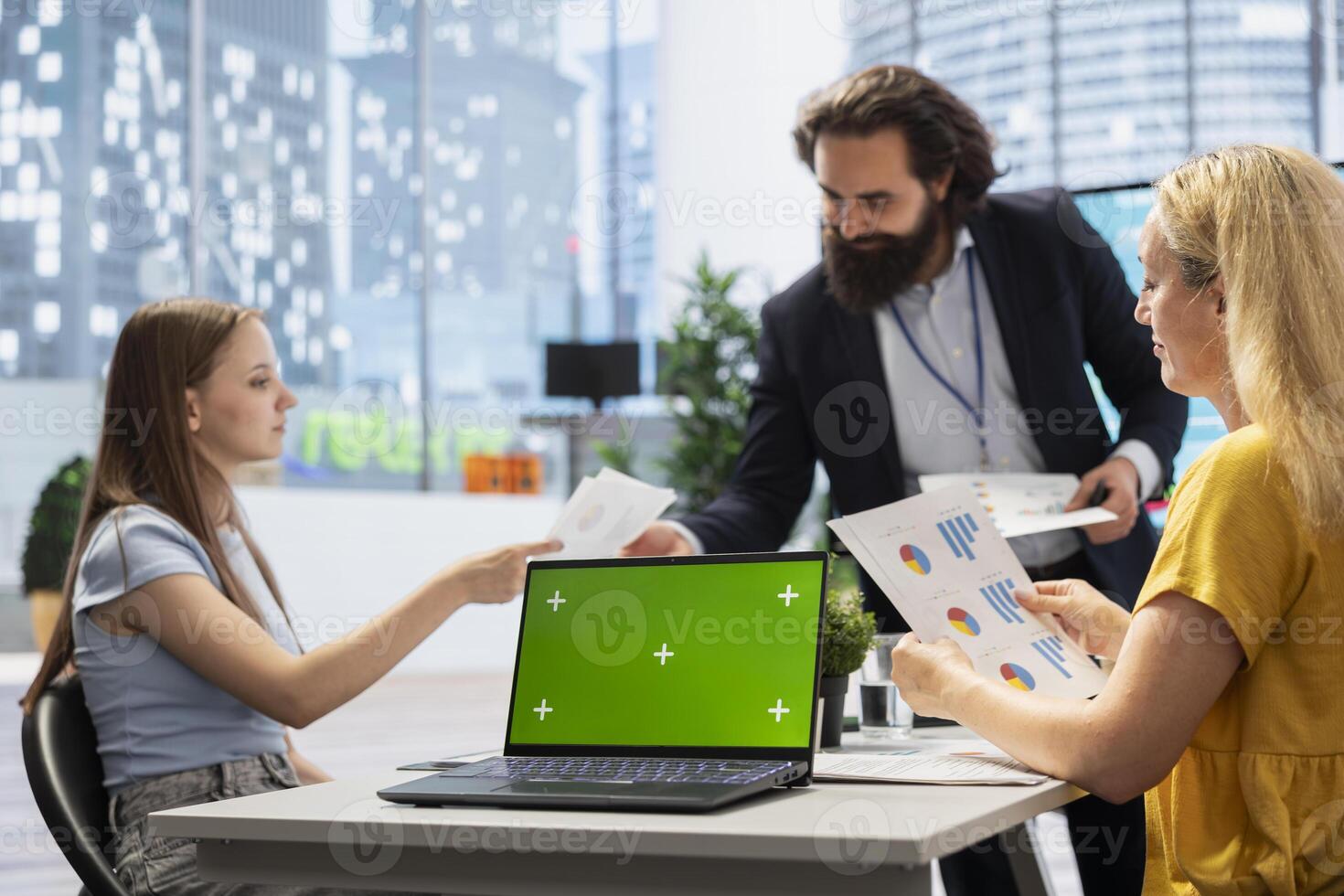 Counselor showing people financial plan on green screen laptop, helping them fulfill economic goals. Advisor teaching clients how to improve financially and increase income using mockup notebook photo