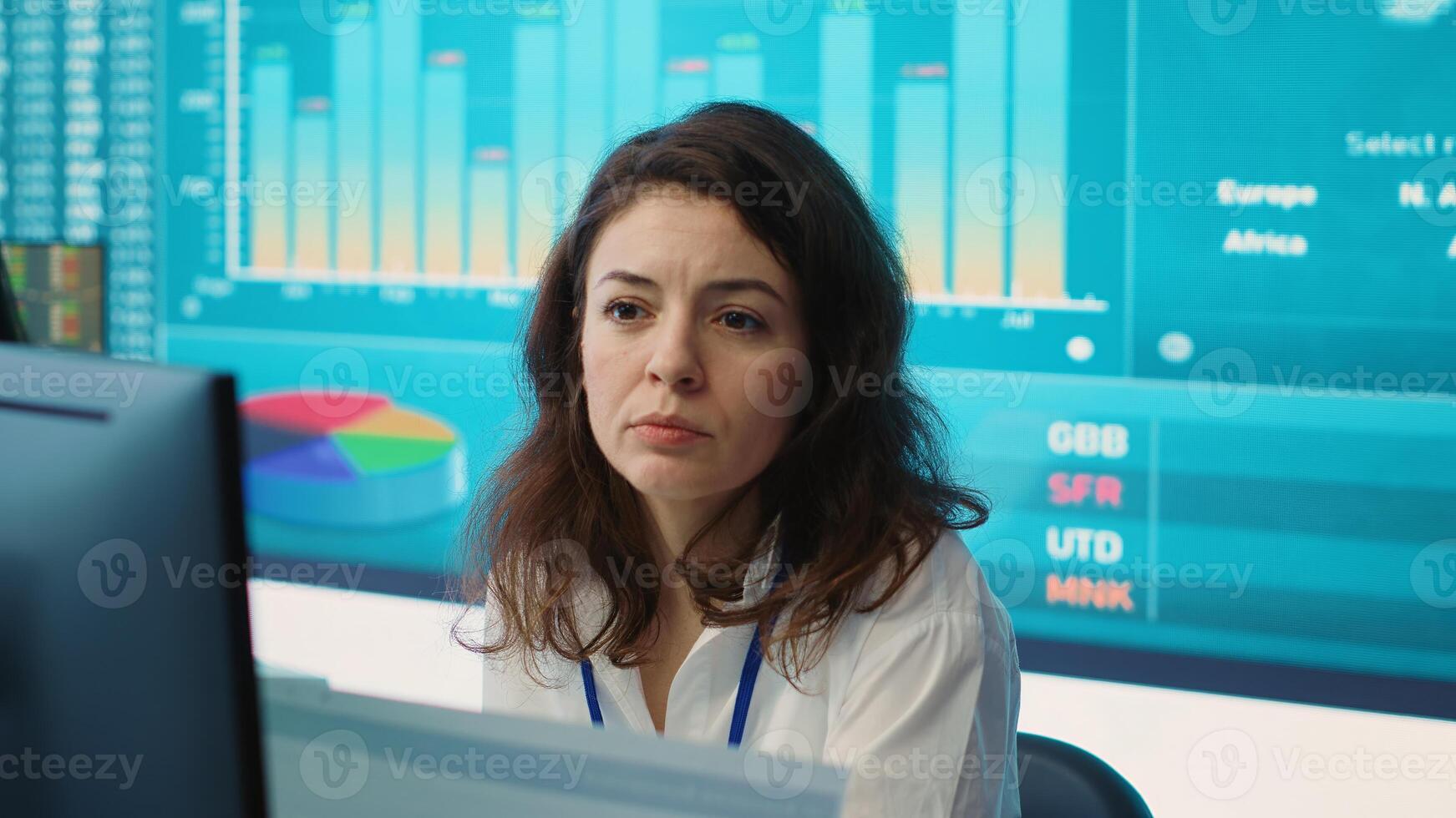 Enterprise worker examines project updates and details in control room, allocate resources and solve tasks to achieve strategic business goals, organizational corporation operations. Camera A. photo