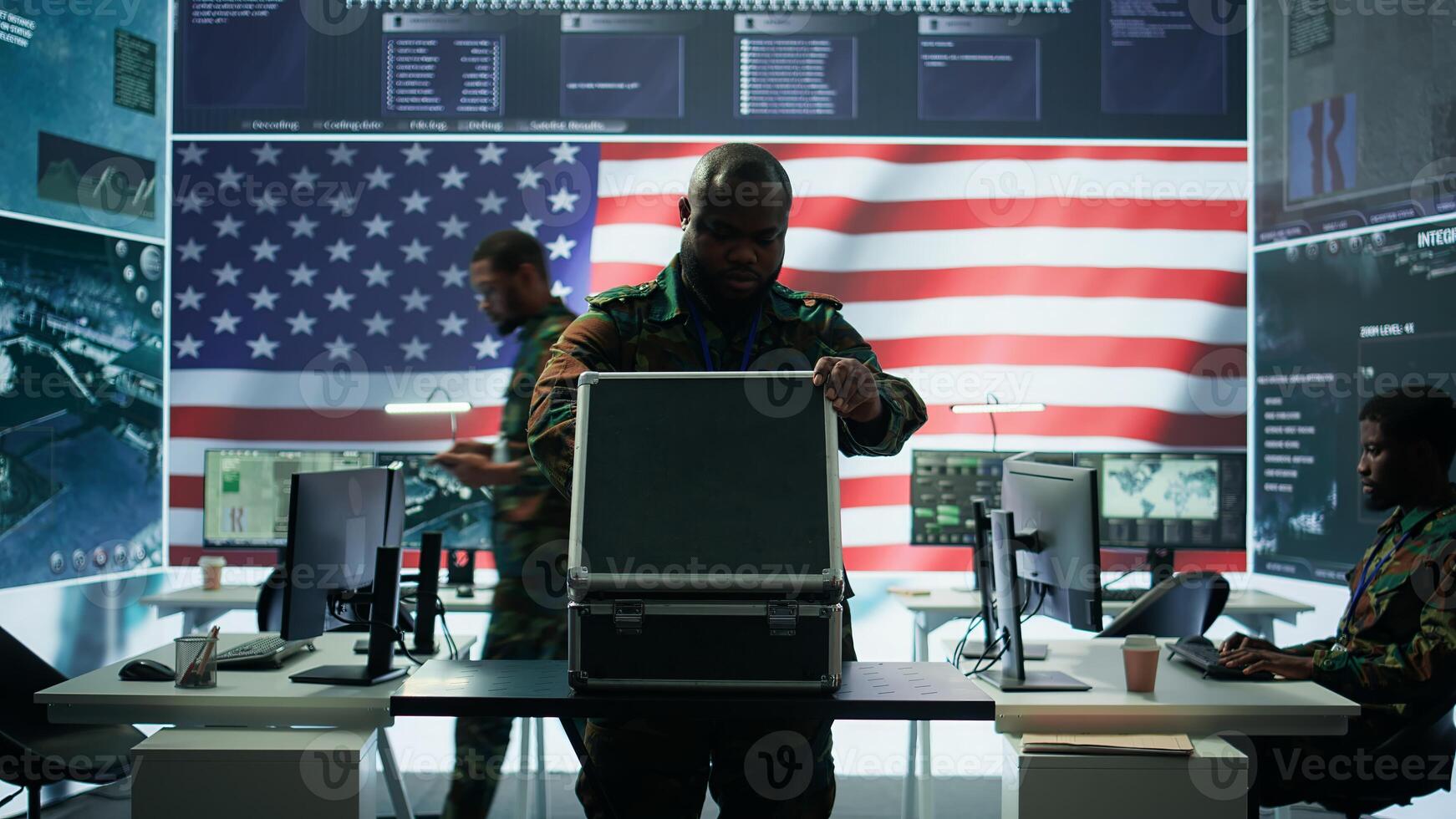 US military personnel work in a modern army command post, safeguarding classified information and state secrets against cyber attacks. Digital warfare and cybersecurity operations. Camera B. photo
