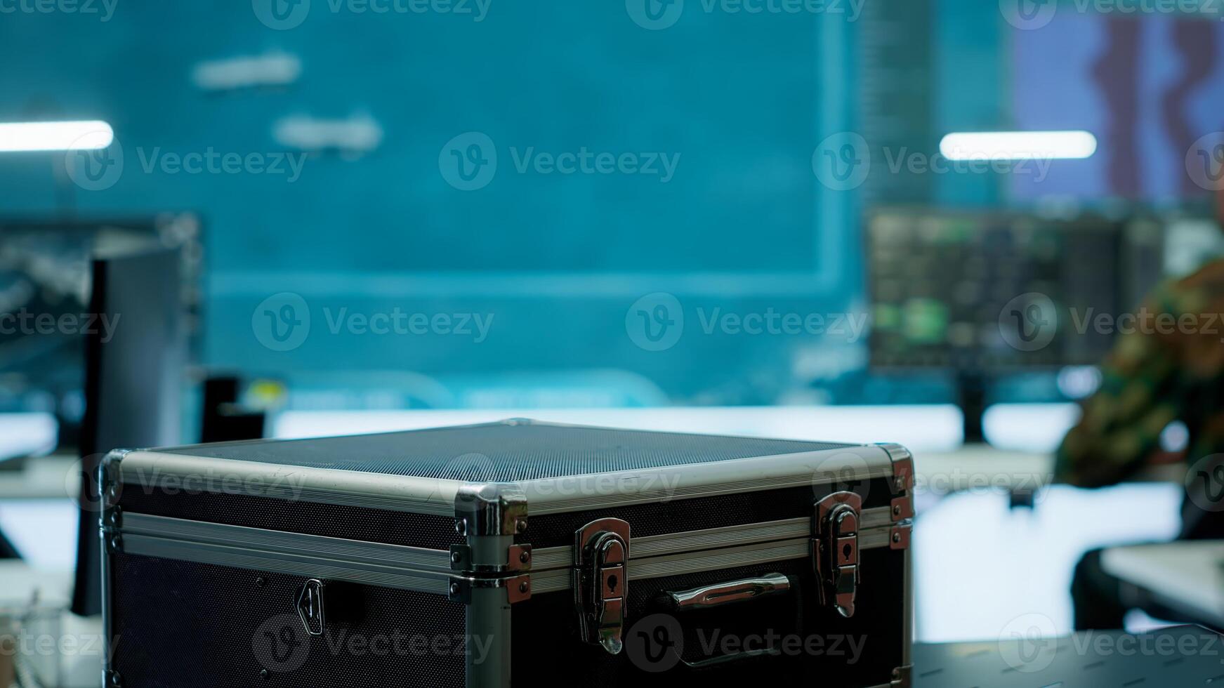 Government intelligence expert works on laptop in a command center to manage surveillance operations, collecting real time data for security measures. Protecting national interests for efficiency. Camera A. photo