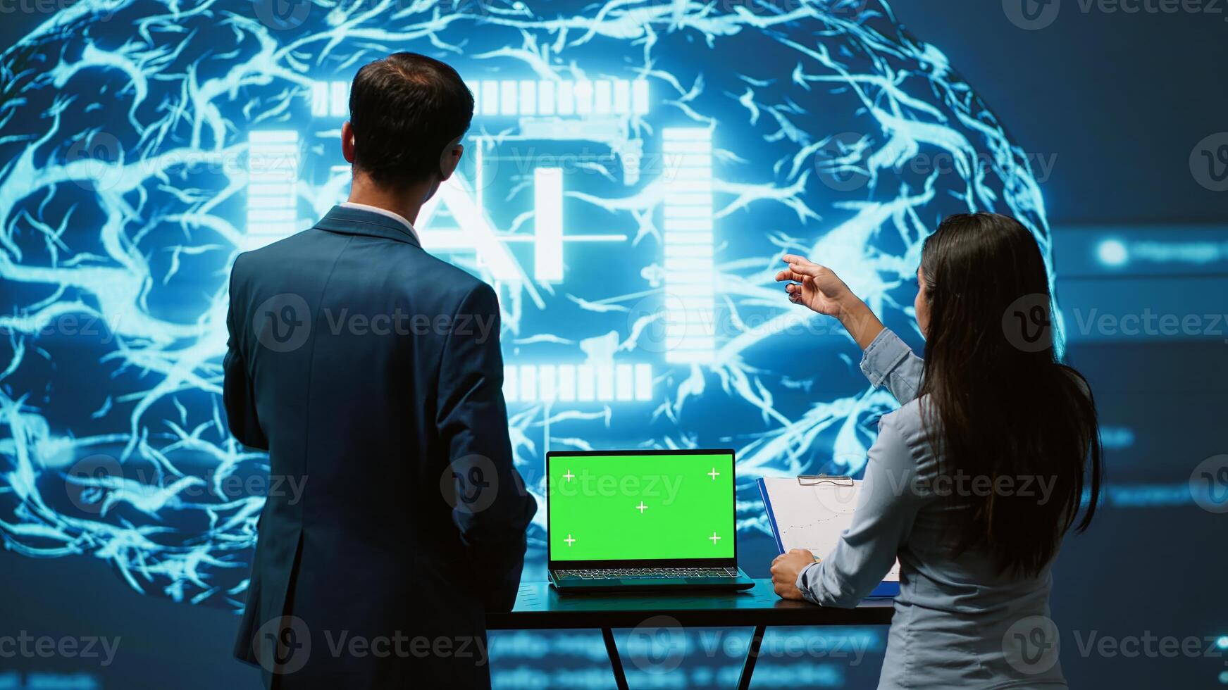 AI developers using isolated screen device for business data analysis. IT department staff members work on chroma key notebook to automatize tasks using artificial intelligence, camera A photo