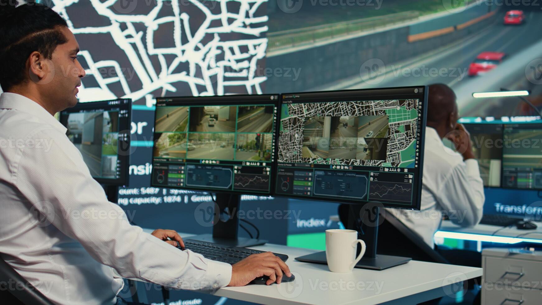 Team of employees monitoring delivery trucks with gps coordinates on satellite navigation, tracking orders with awb shipping system. Operators working in control center. Camera B. photo
